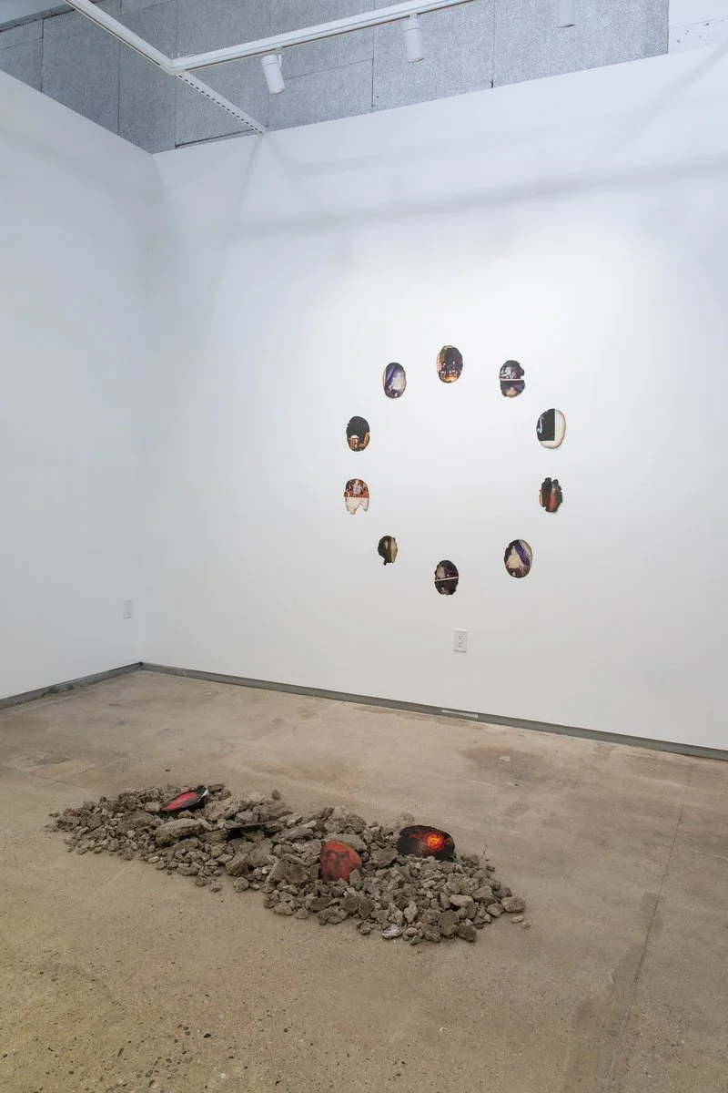 Untitled, 2025. Found imagery and concrete.  
*images from this installation were the only remains found at artist's burned down house after the Eaton Fire in Altadena, California. They originally came from a book titled Seance by Shannon Taggart.