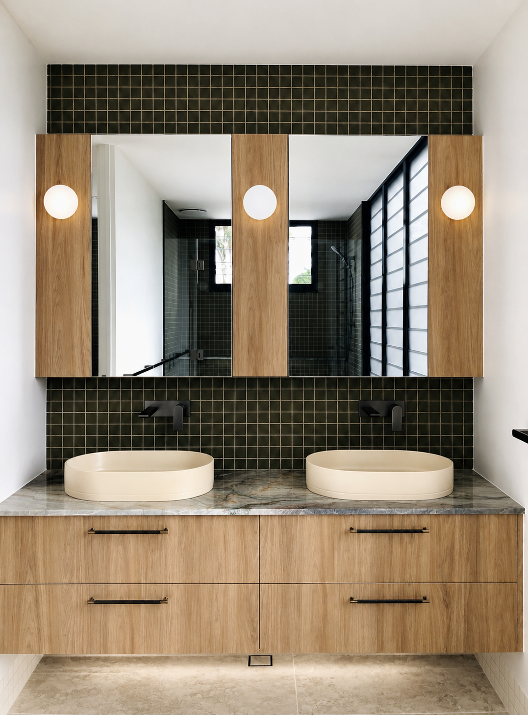 Modern bathroom with double sink vanity, oval beige vessels, black wall-mounted faucets, large mirror with wood framing, black tiled backsplash, and a shower visible through windows and a black grid screen.