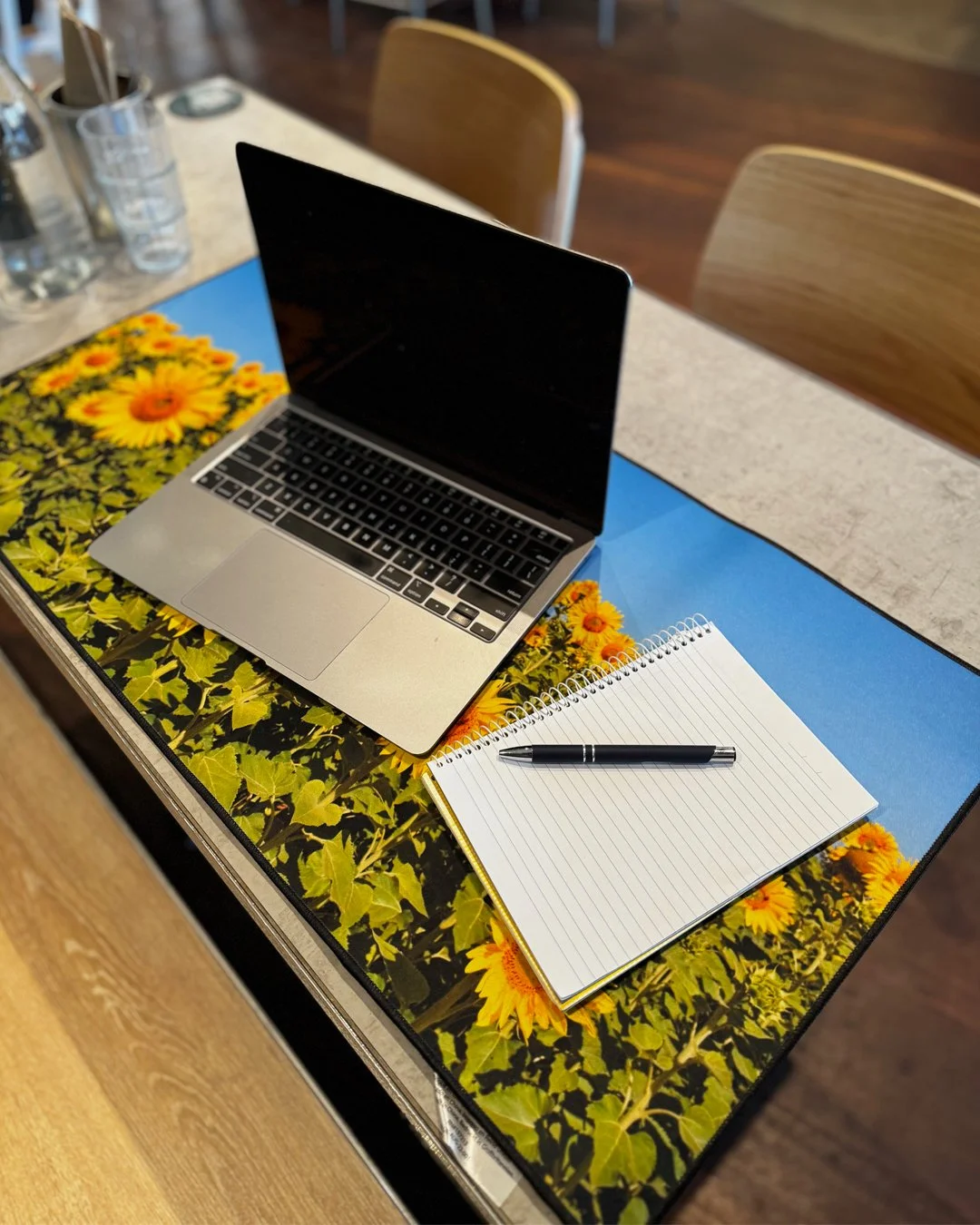 I am so happy with my new desk mat from Redbubble with my sunflower image on it.

It is sooo big and the quality is great.  You can see from the first couple of photos that are mine taken at a local cafe how big it is plenty of room for everything to