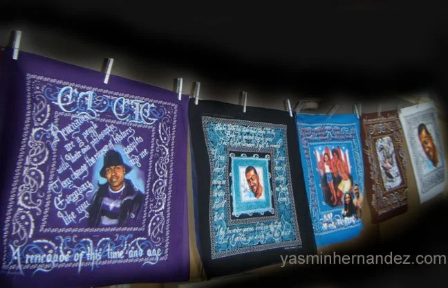 Detail, “Outlaw Clothesline.” Yasmin Hernandez. Nine mixed media paintings on cotton bandanas, 20" x 20" each, chrome chain, clothespins. The Outlaw Clothesline is an installation comprised of mixed media works on bandanas in memory of my brother Jos