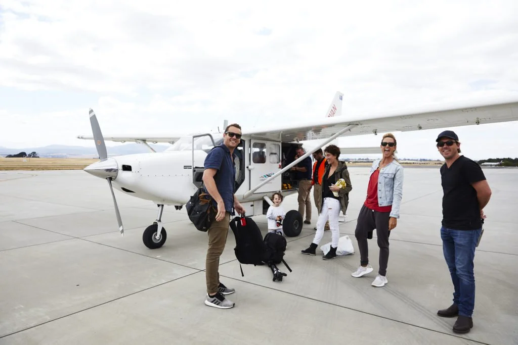 Flights to Flinders Island | Flinders Island Aviation | Group boarding plane