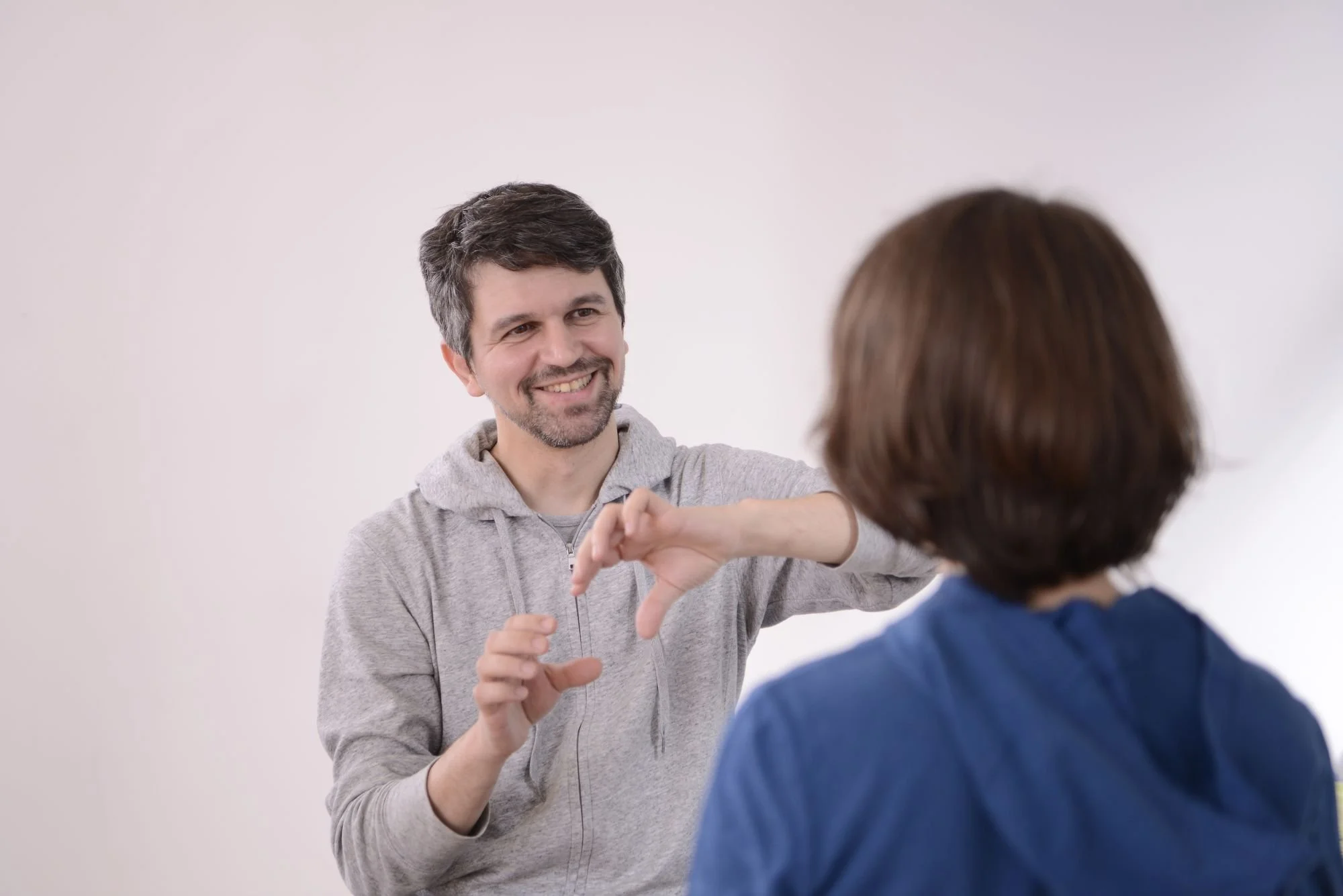 Practitioner smiling while talking to client