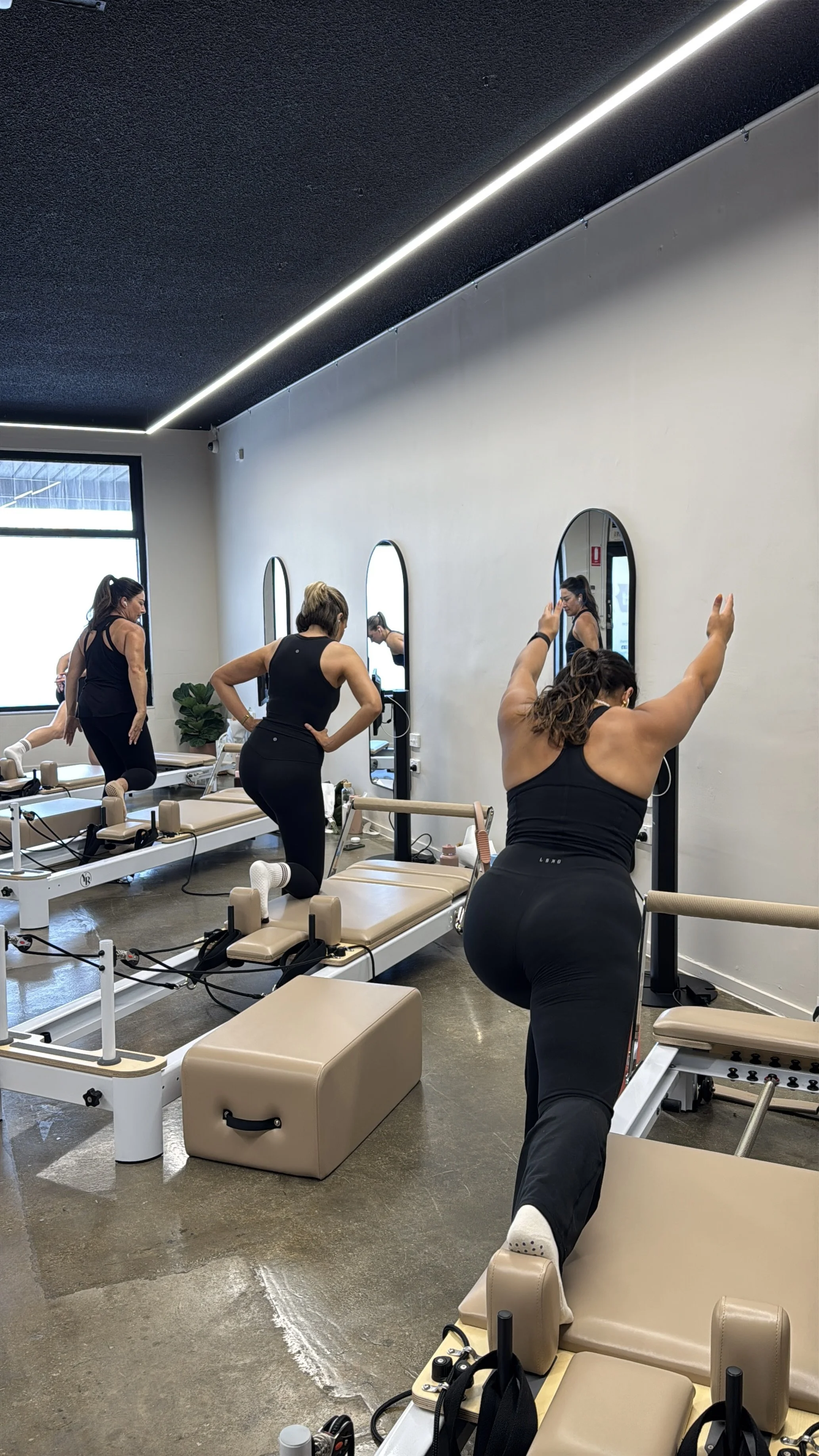Members doing a reformer workout