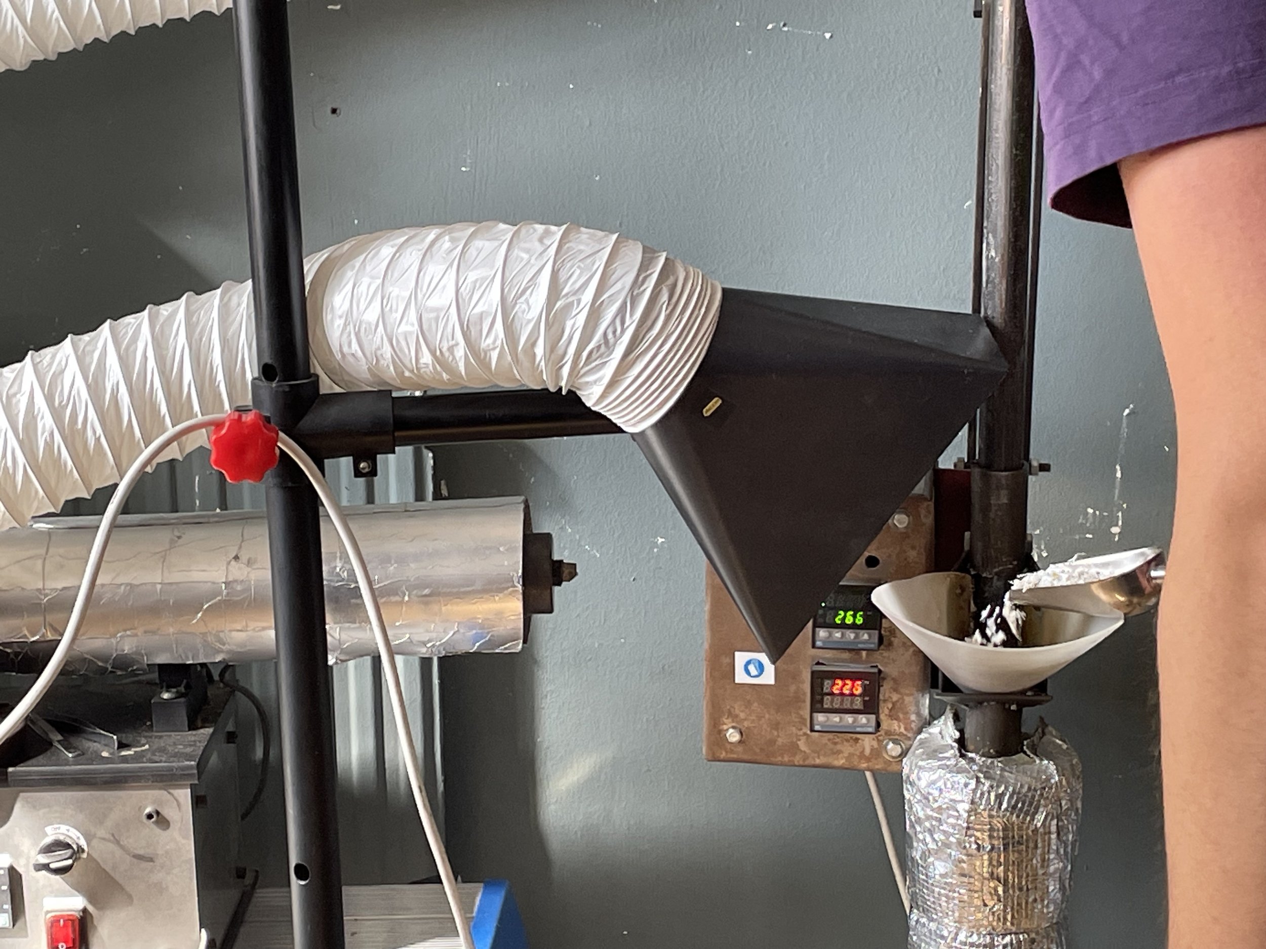 PLASTIC CHIPS ARE LOADED INTO THE HOPPER.