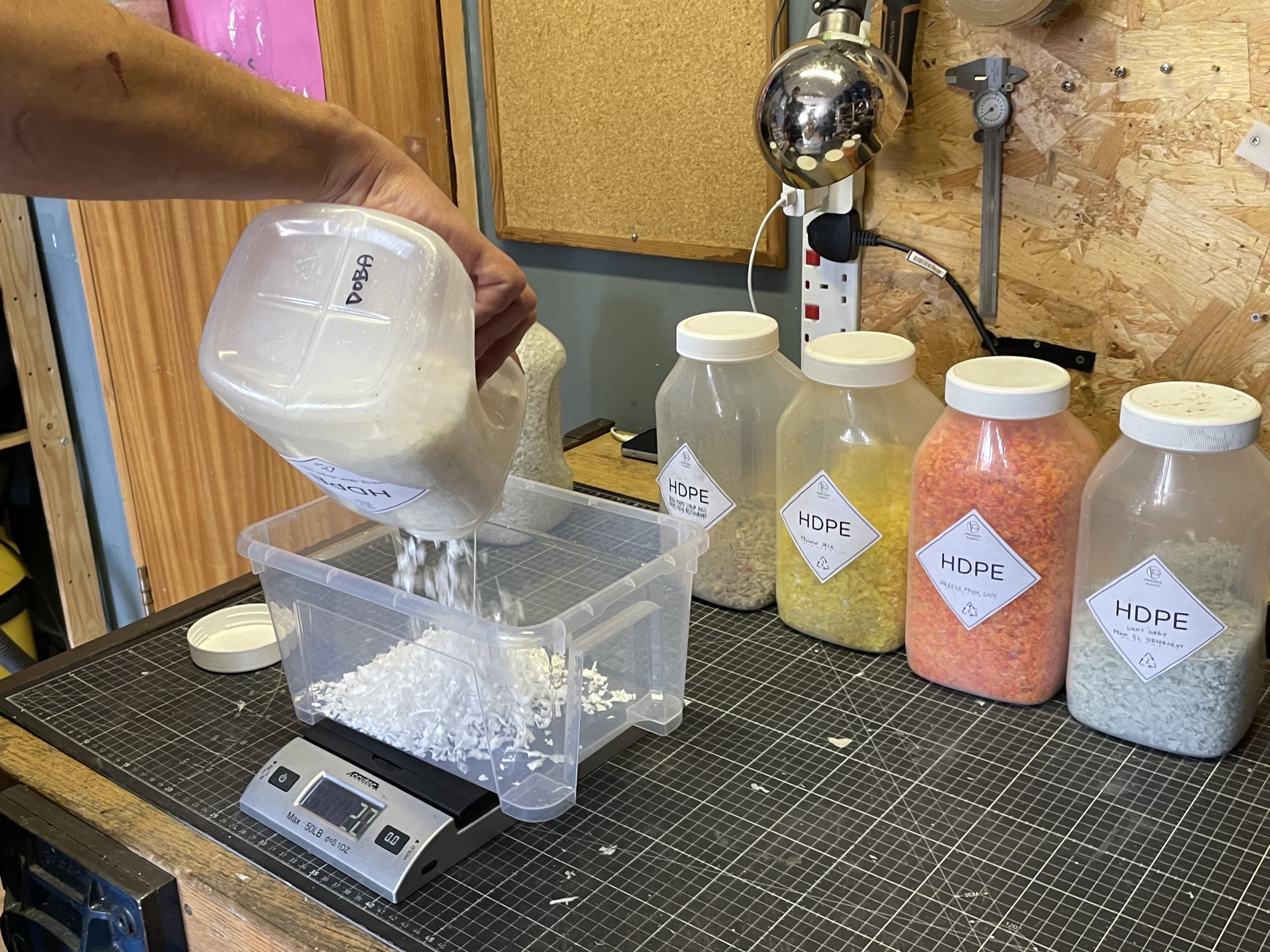 SHREDDED PLASTIC IS PRECISELY WEIGHED AND MIXED.