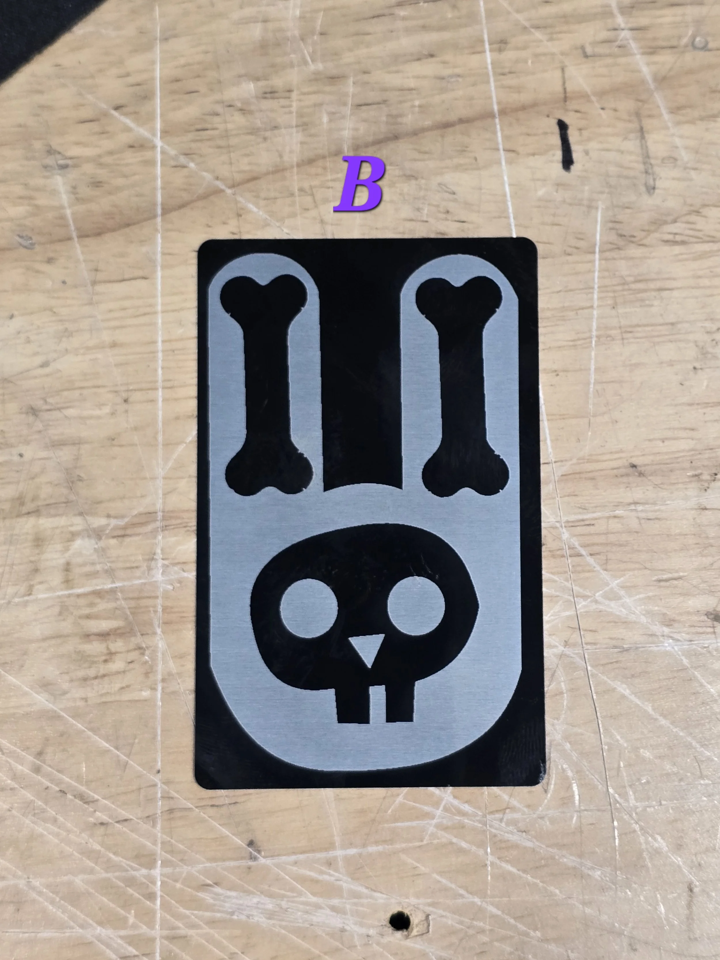 Bone Bunny engraved on a plated metal card