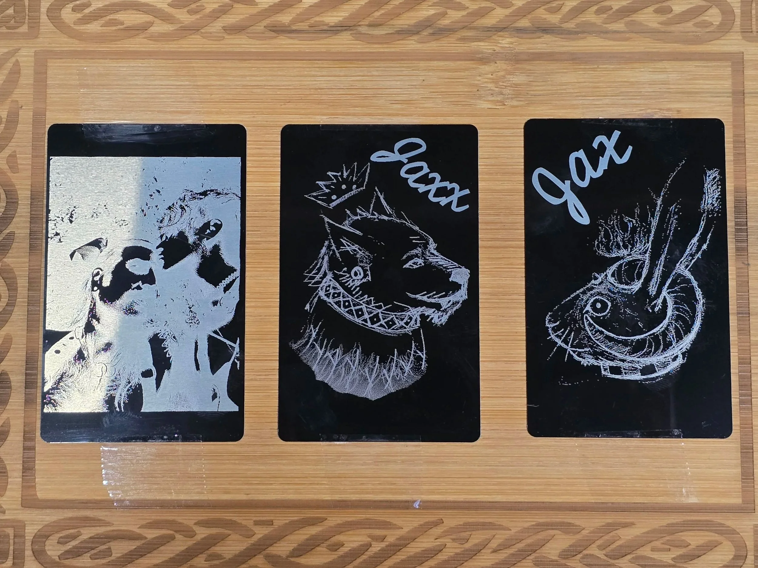 Fursonas and an image of the couple together laser engraved on plated metal cards