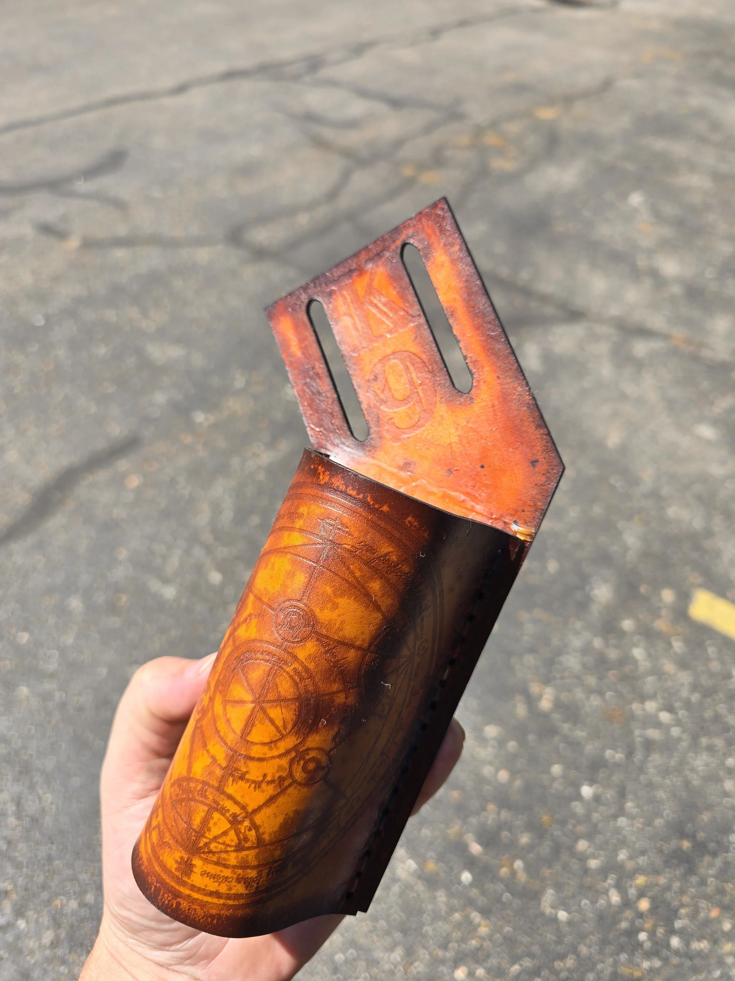 Hammer holder made for a co worker, K9 was a specific request and the front features the Grand Array Alchemy Circle from Full Metal Alchemist. 
