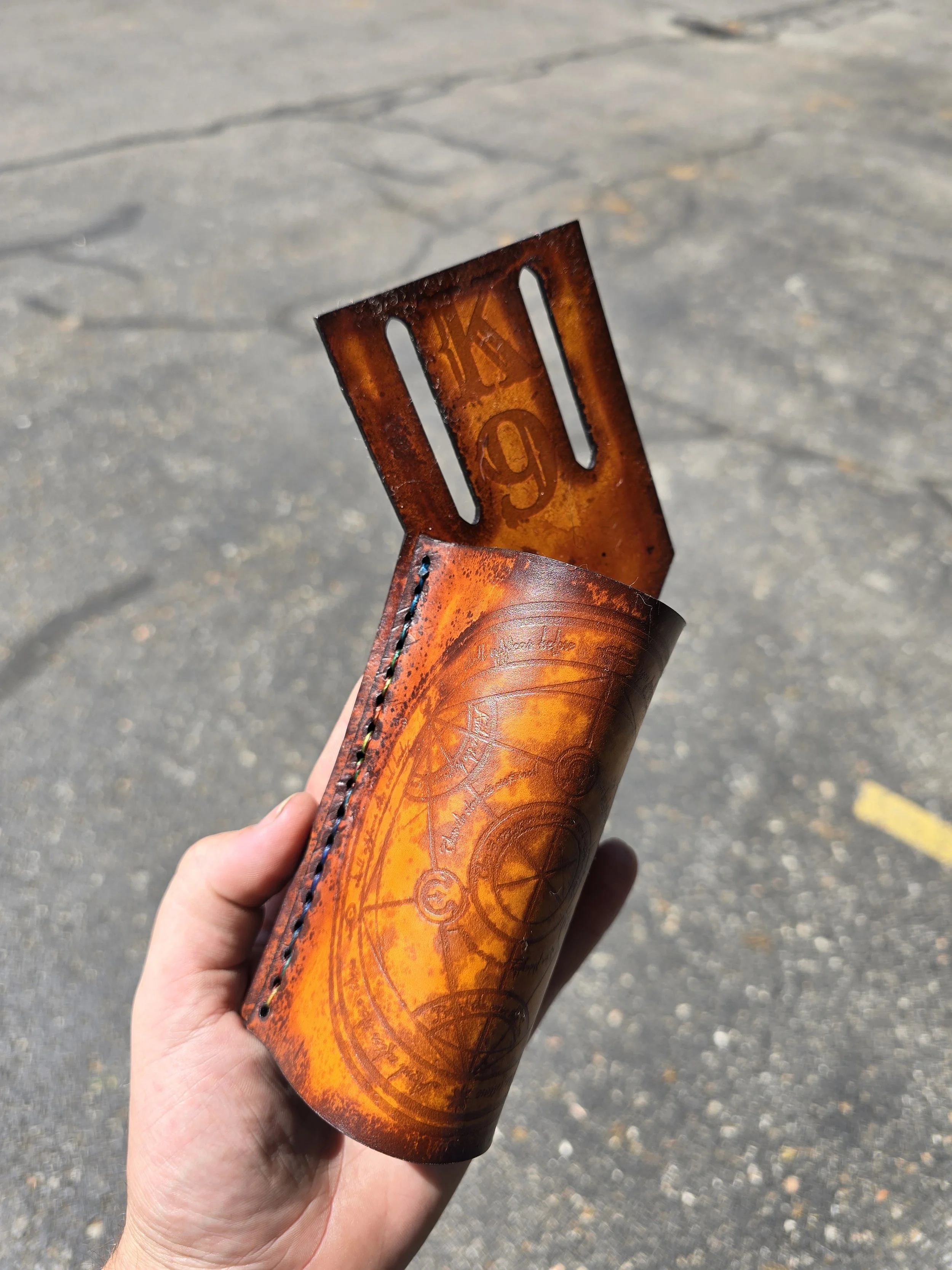Hammer holder made for a co worker, K9 was a specific request and the front features the Grand Array Alchemy Circle from Full Metal Alchemist. 