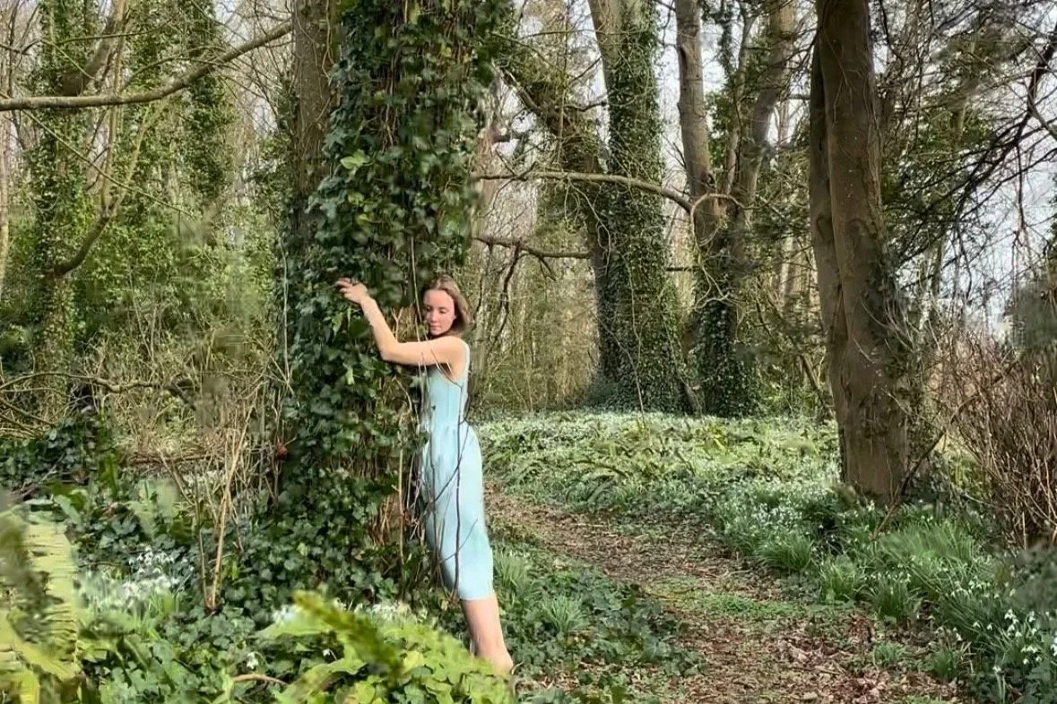 a woman hugging a tree to connect with her authentic self and nature