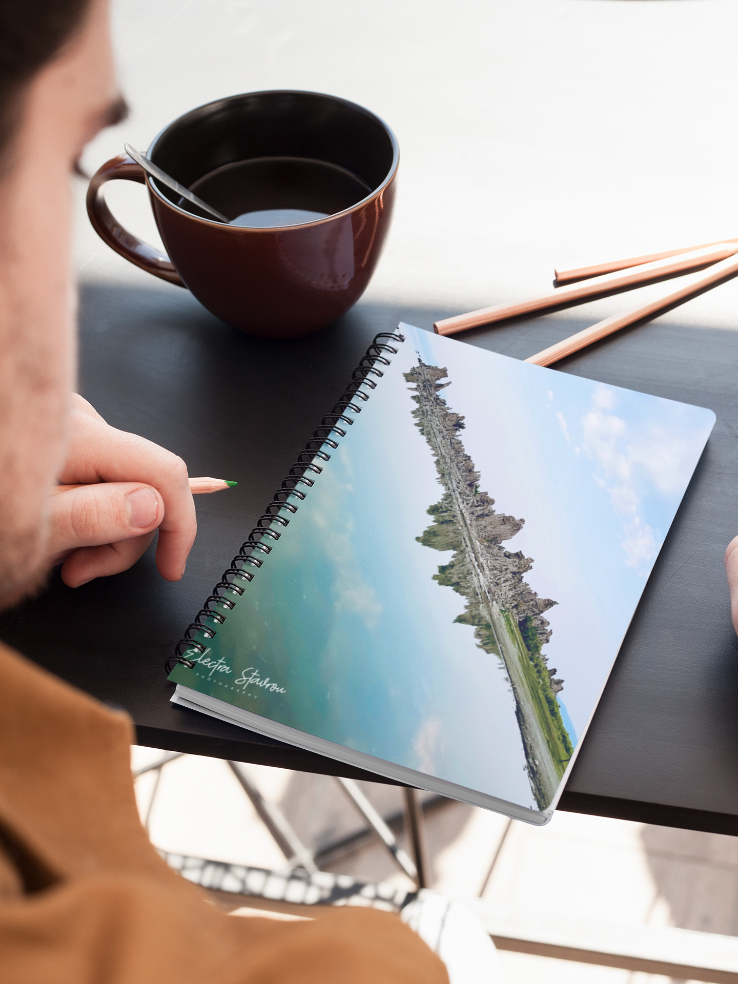 mockup-of-a-notebook-placed-on-a-table-next-to-colored-pencils-24187.png