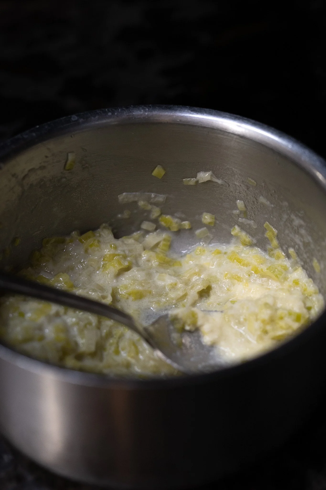 Cooking pot with melted butter and chopped leek. The Lamb Inn. 