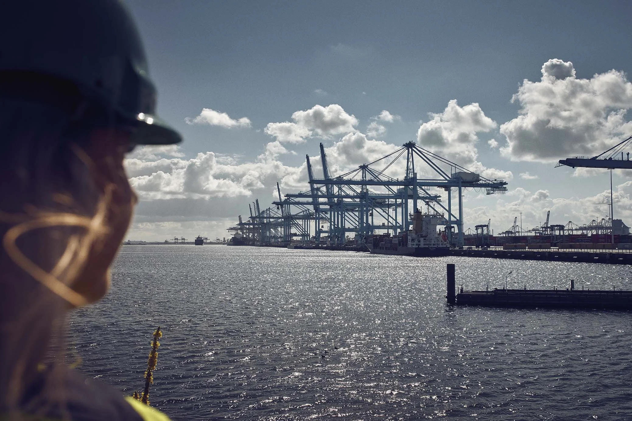 View across a maritime port with shipping cranes, representing Mærsk Mc-Kinney Møller Center for Zero Carbon Shipping’s feature in the June 2026 Green Sustainability Magazine.