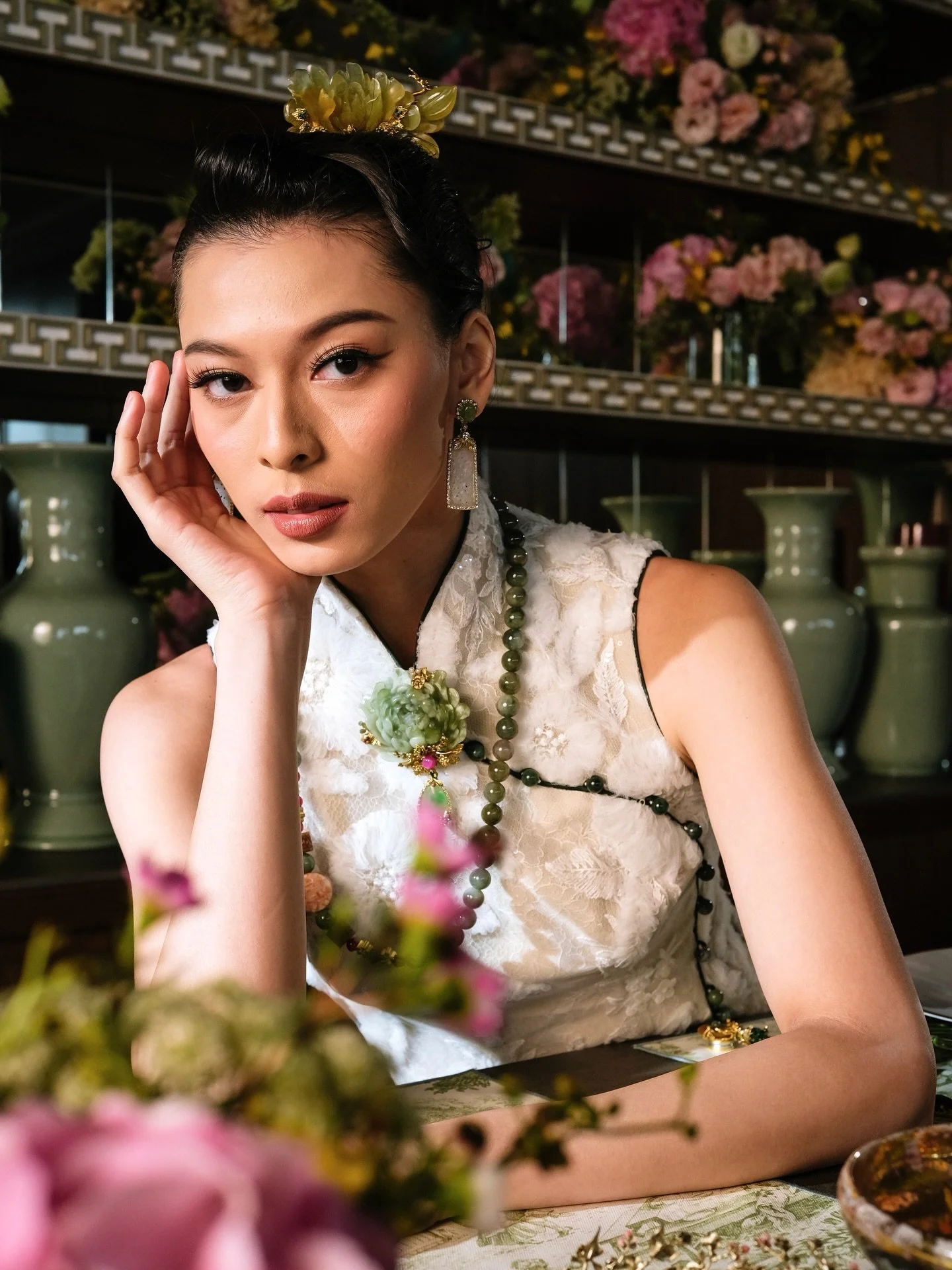 Blooming in stillness, adorned in soft florals and timeless jade. A quiet moment before the festivities begin. 

In the frame: Yellow Jadeite Hairpiece, Ice Jade Earrings, Mixed Jadeite necklace, Carved Jadeite brooch

The Celestial Bloom collection 