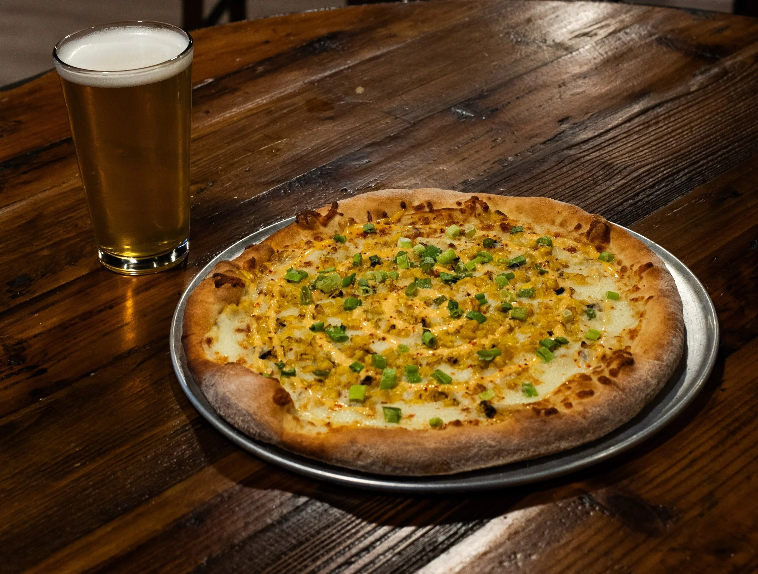 Great food and great beer! Have our Jetty Honey Ale with a Street corn pizza!!
