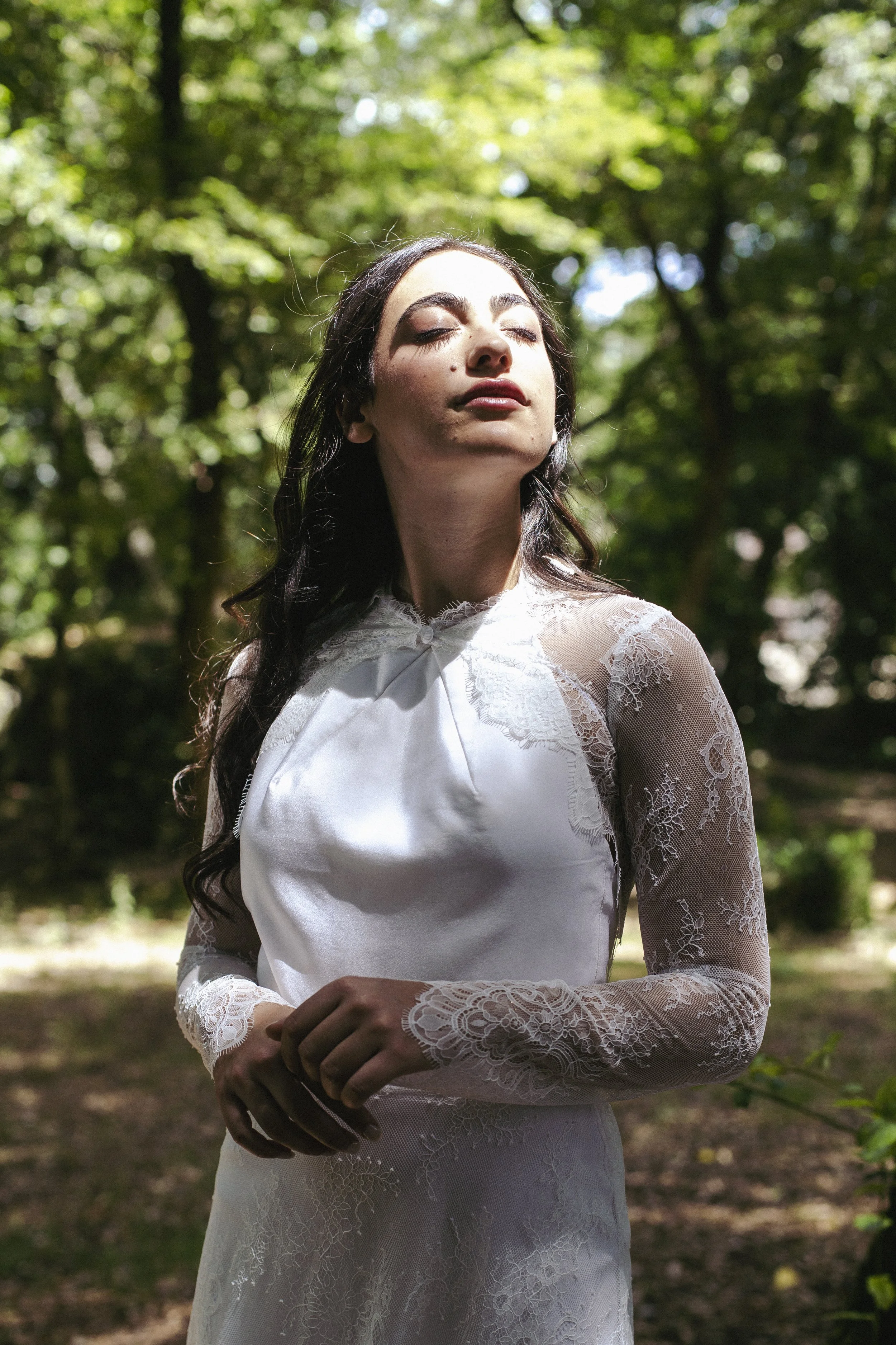 Hebe Lace Jacket
Starting from €370
A delicate short jacket in Chantilly lace, featuring hand-applied lace detailing around the neckline and throughout. Long sleeves and a high collar give it an ethereal, timeless quality — the perfect layer to add r