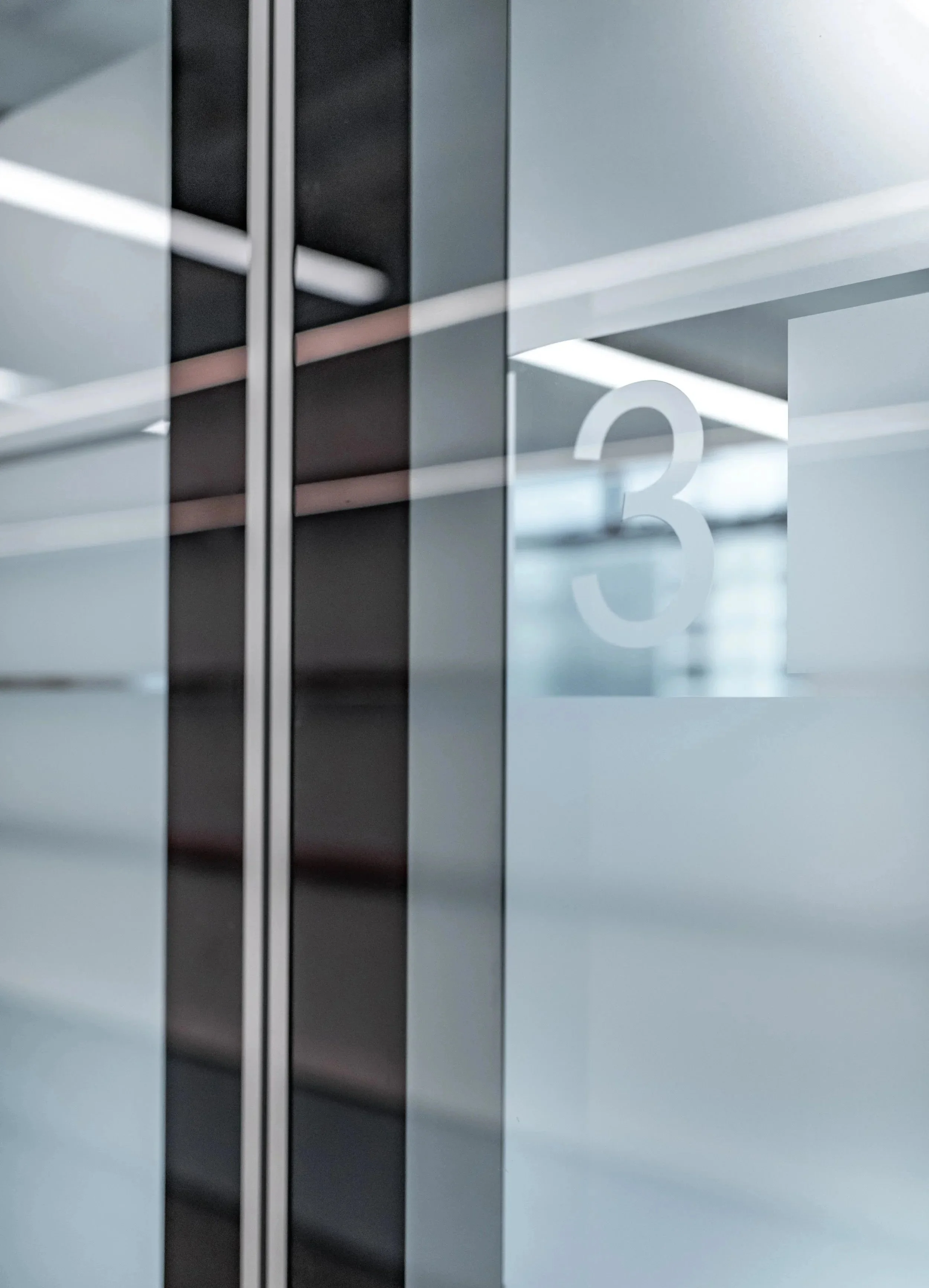 Commercial architecture and interior design at Minterellison LLP Hong Kong displaying clean commercial office space with industrial architectural elements.
