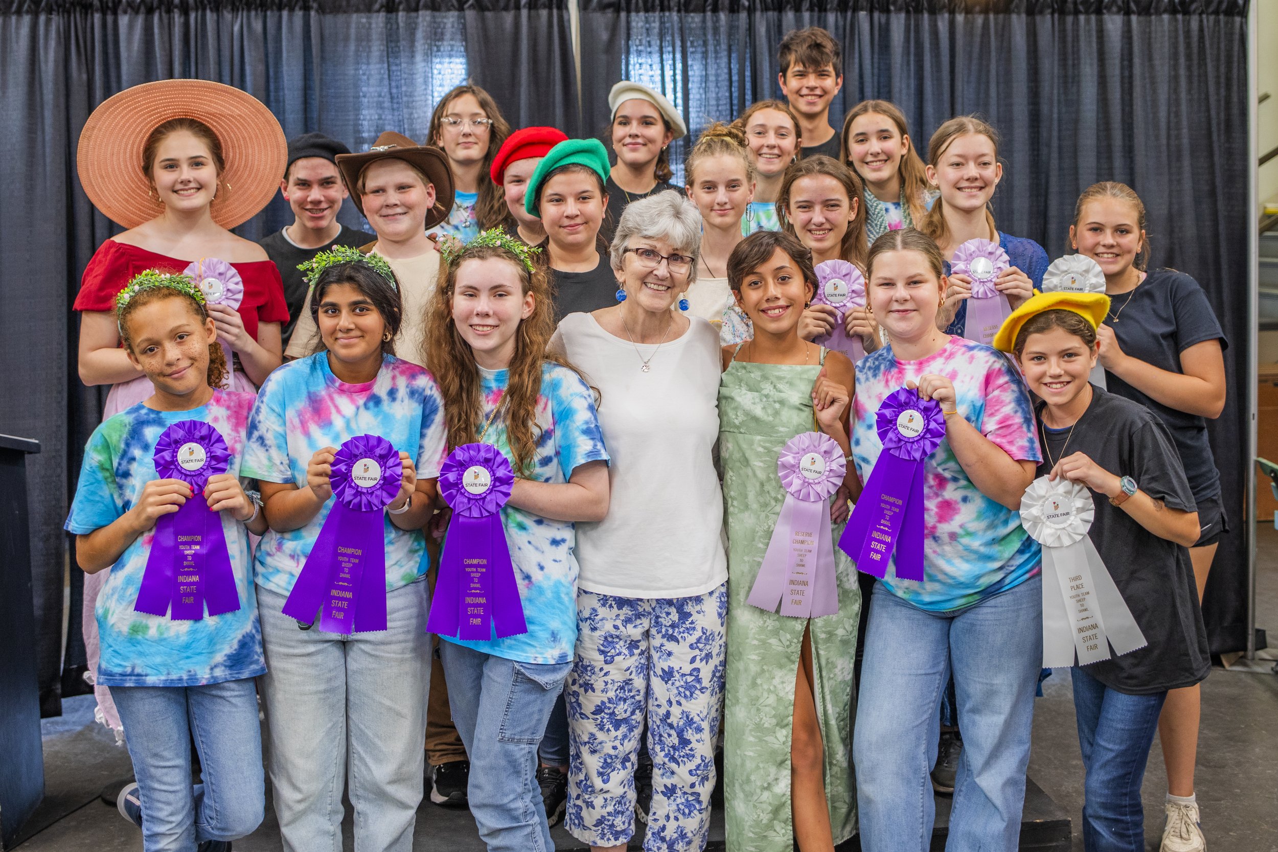 Conor Prairie Youth Spinners have a photo op at the Indiana State Fairgrounds with their ribbons
