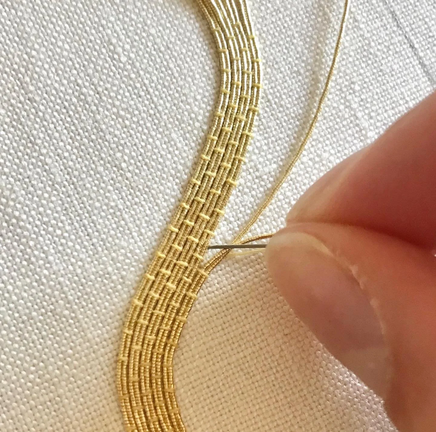 Save this for later ✨ My top tip for couching in Goldwork embroidery

If I could share just one key piece of advice for Goldwork embroidery, it would be this: always think about the angle of your needle when couching passing &mdash; both as it comes 