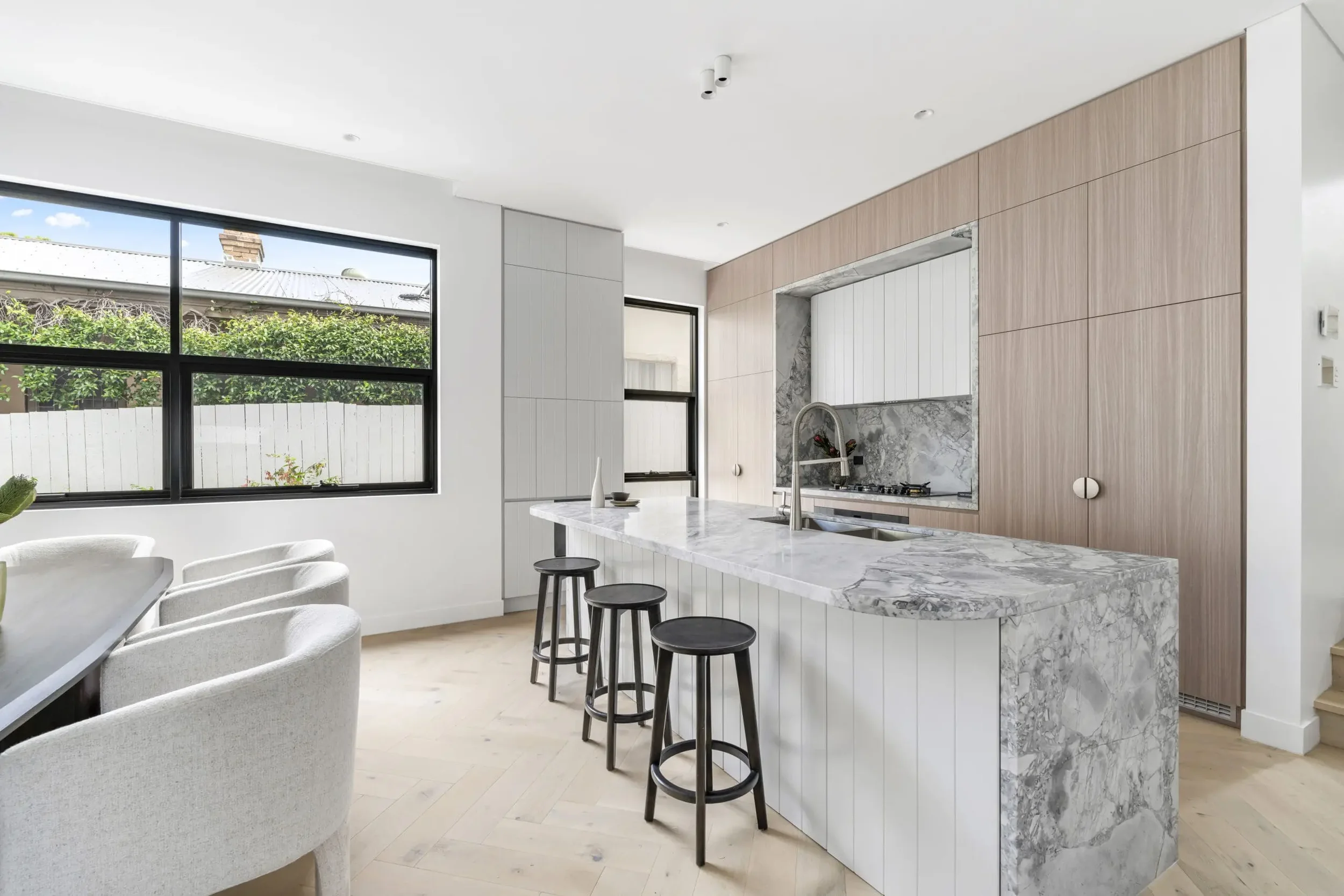 Modern kitchen with island benchtop and clean cabinetry