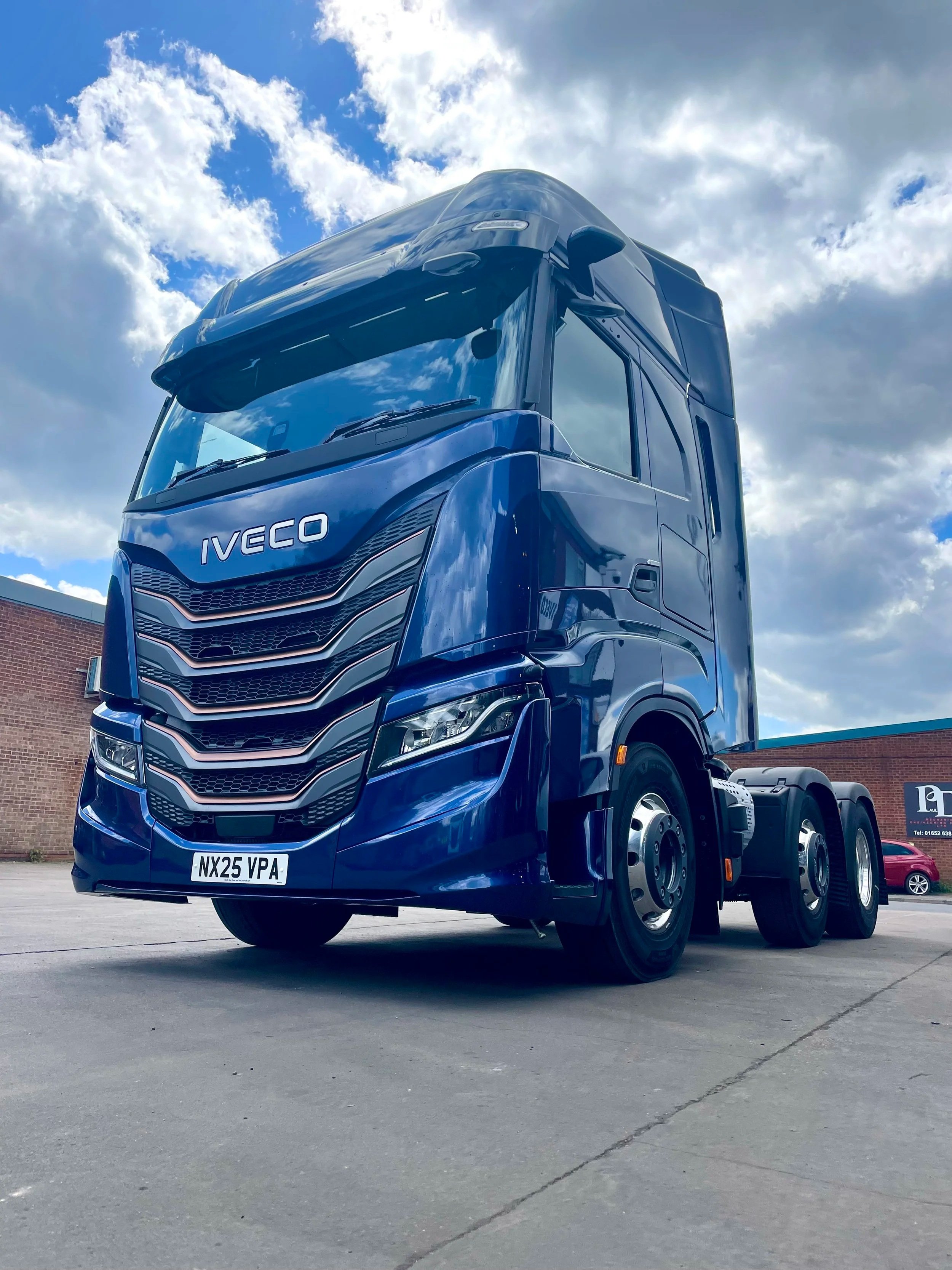 A large blue Iveco S WAY MY24 6 x 2 Tractor Unit, ready for demonstration.