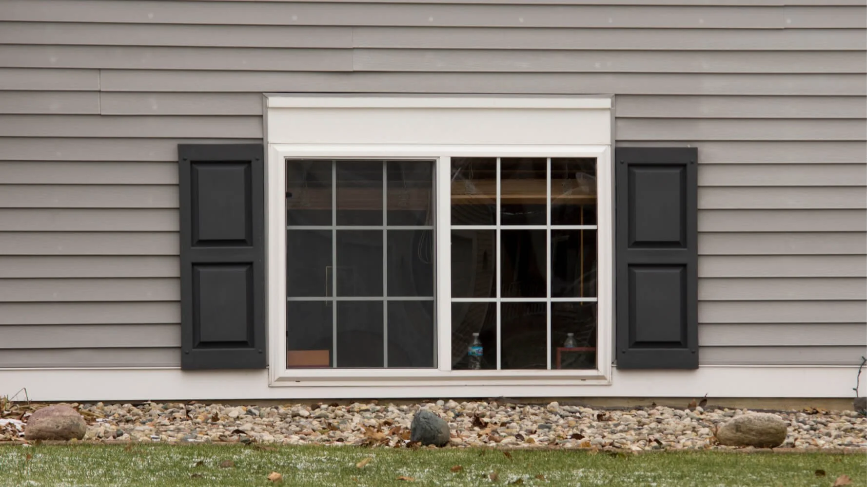 Photograph of vinyl shutters highlighting the impact of painting vinyl shutters for a refreshed exterior look