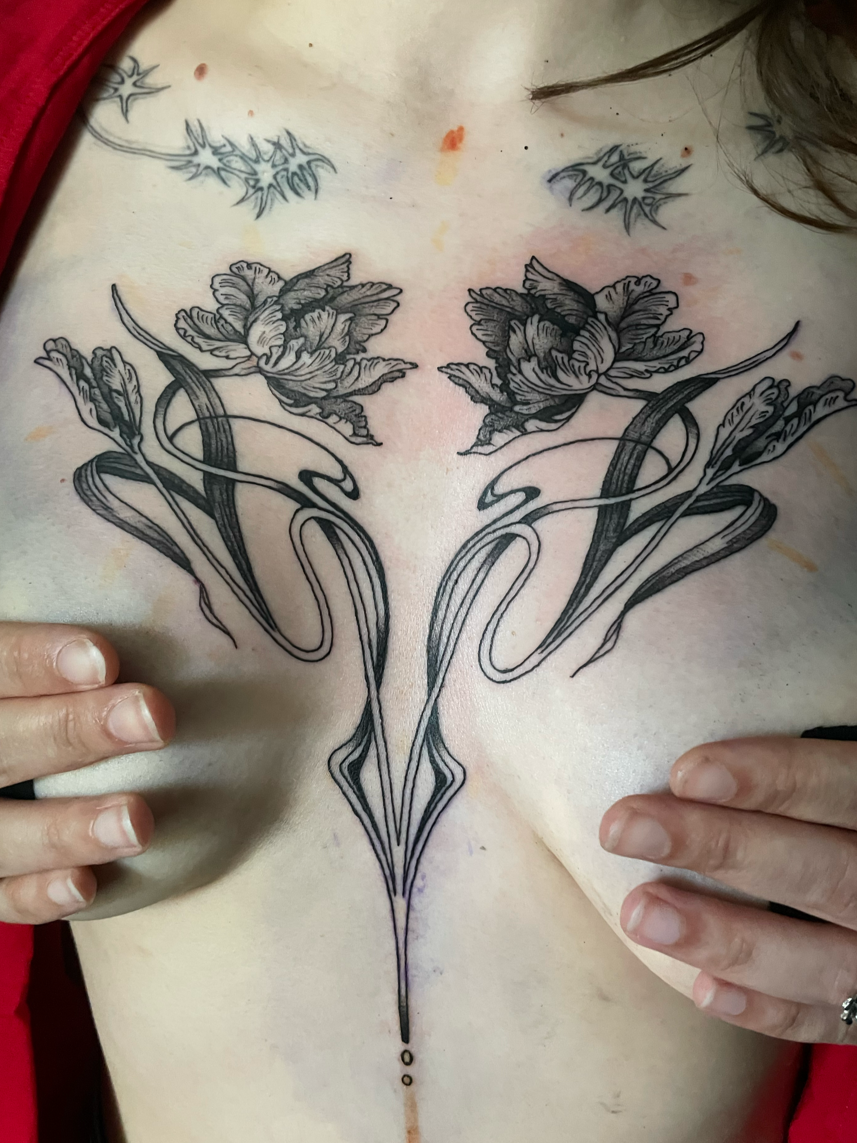 art nouveau filly flower chest sternum tattoo delicate shading ornamental