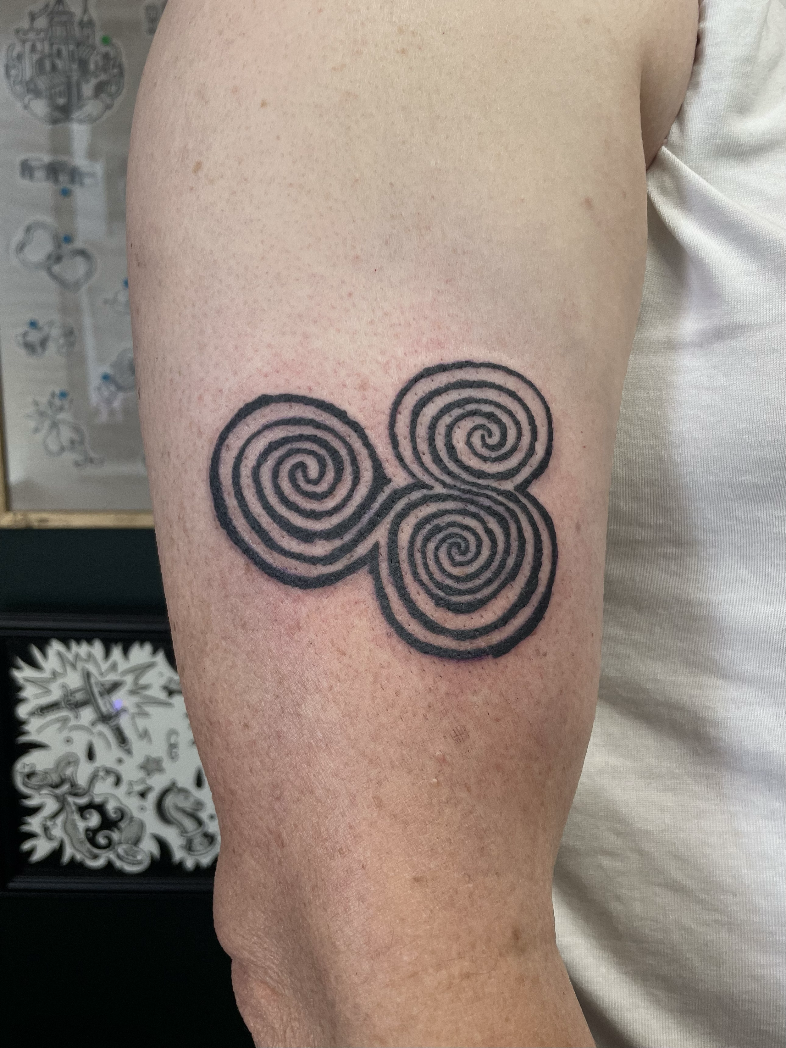 newgrange triskel triple spiral engraved stippling irish tattoo