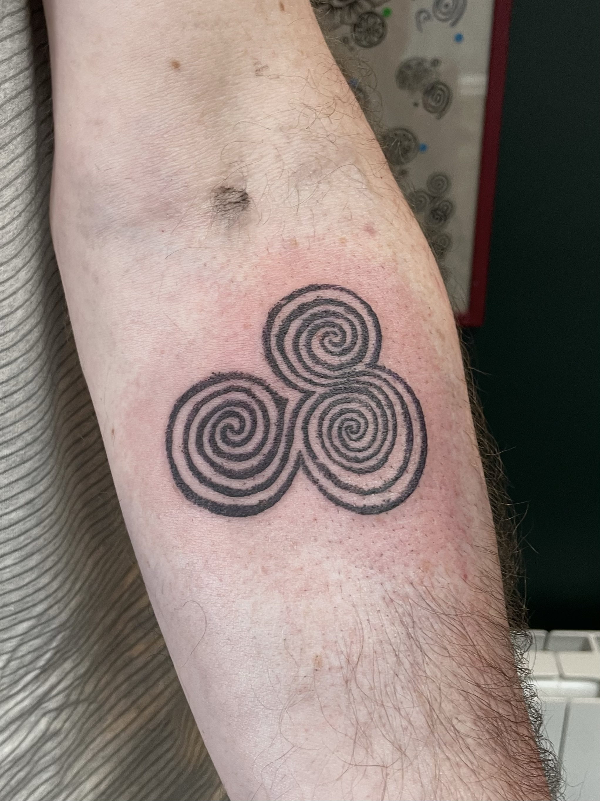 newgrange triskel triple spiral engraved stippling irish tattoo