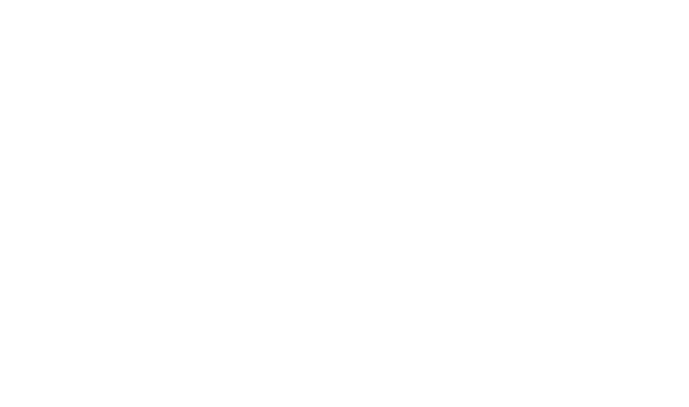 Silhouette of a woman's face with mountains in the background.