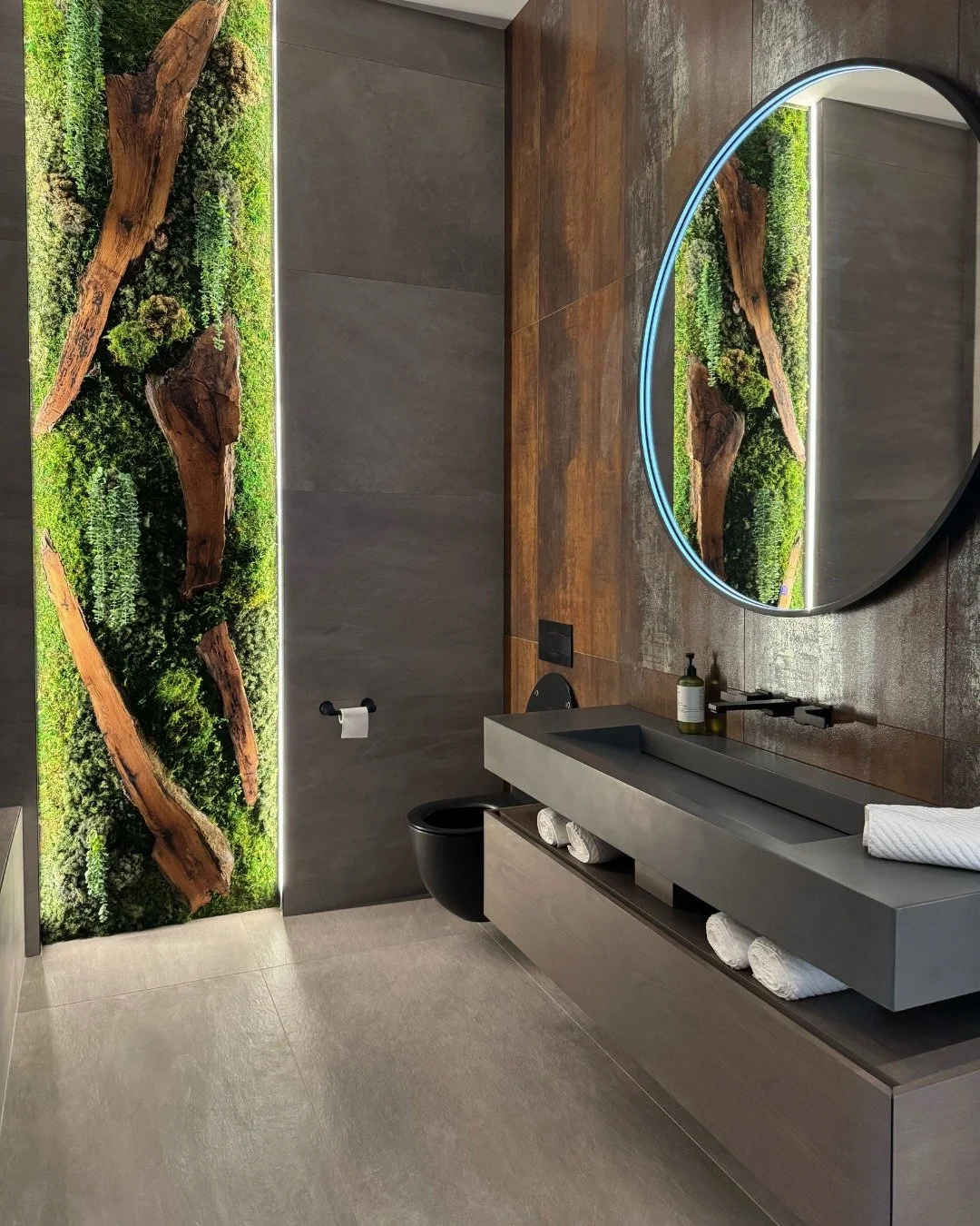 Every detail in Project Starr’s bathroom speaks for itself. Rust-coloured tiles bring the warmth, the white oak floating vanity adds the edge, and that botanical wall? A showstopper 🙌 
#bathroomdesign #luxurybathroom #bathroomcabinets #bathro