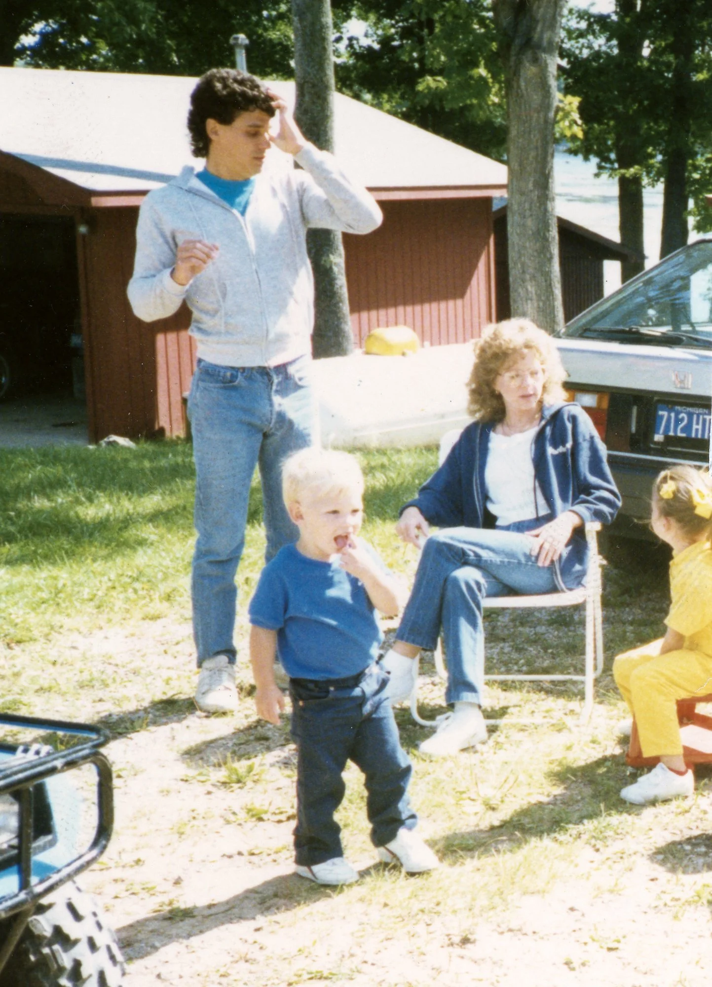 The Travis family enjoying a spring day at a friend's lake house. The photo was shot outside a Don White's cabin on South Dease Lake, near Hale, MI.