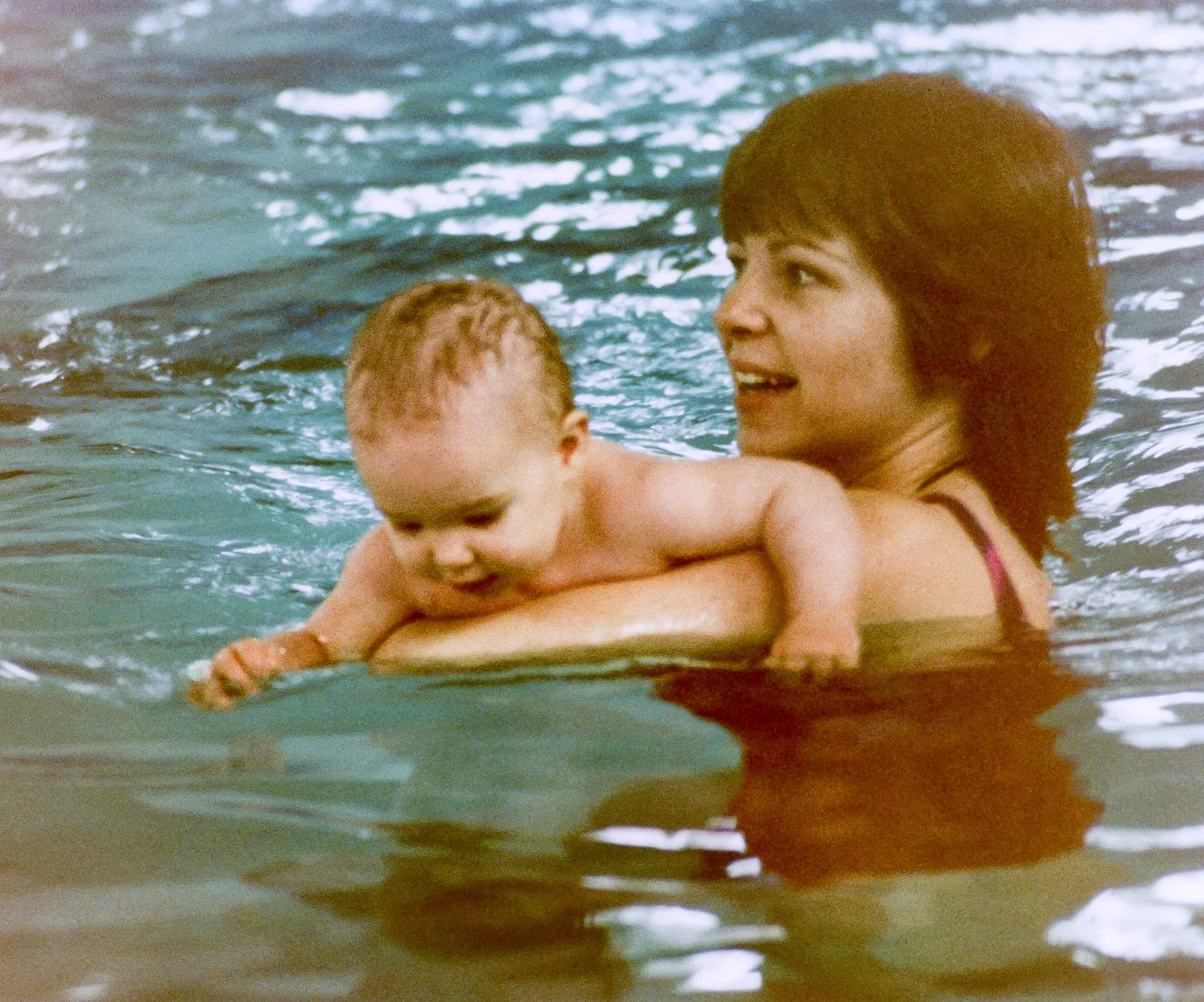 Roni helping Kelly with swimming lessons. 