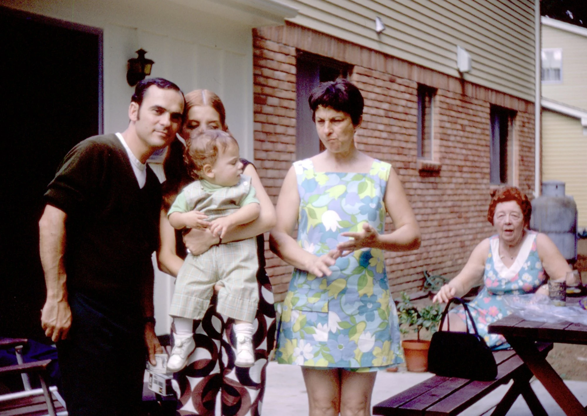 Bill, Kaye, Bill Jr., Sue, and Betty Rittinger captured in a photo on Bill and Kaye’s patio at their home on Eaton Gate Road in Lake Orion, Michigan.
