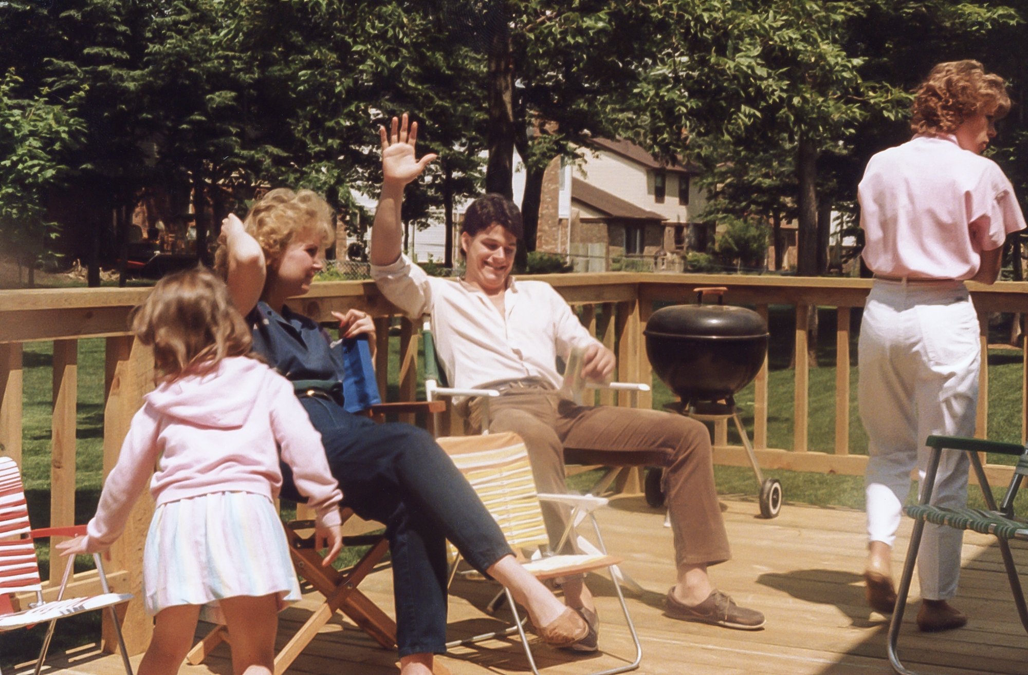 Chilling on the deck are Kelly, Judy Schramke, Rich, and Roni. 
