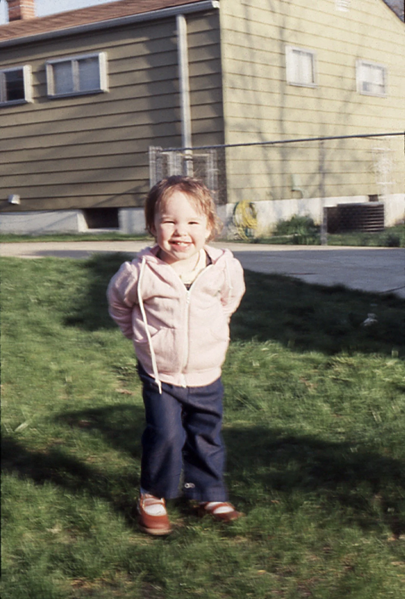 Kelly in the backyard of our house on Danzig, in Livonia.