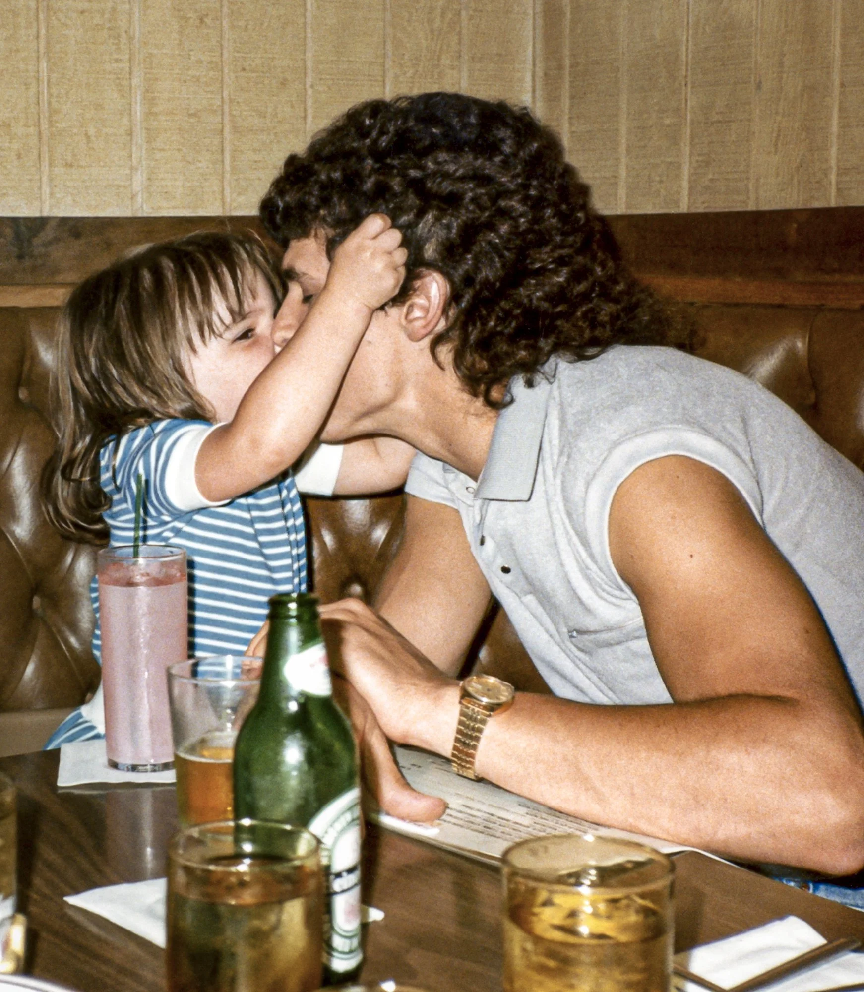 Kelly giving her dad a kiss.