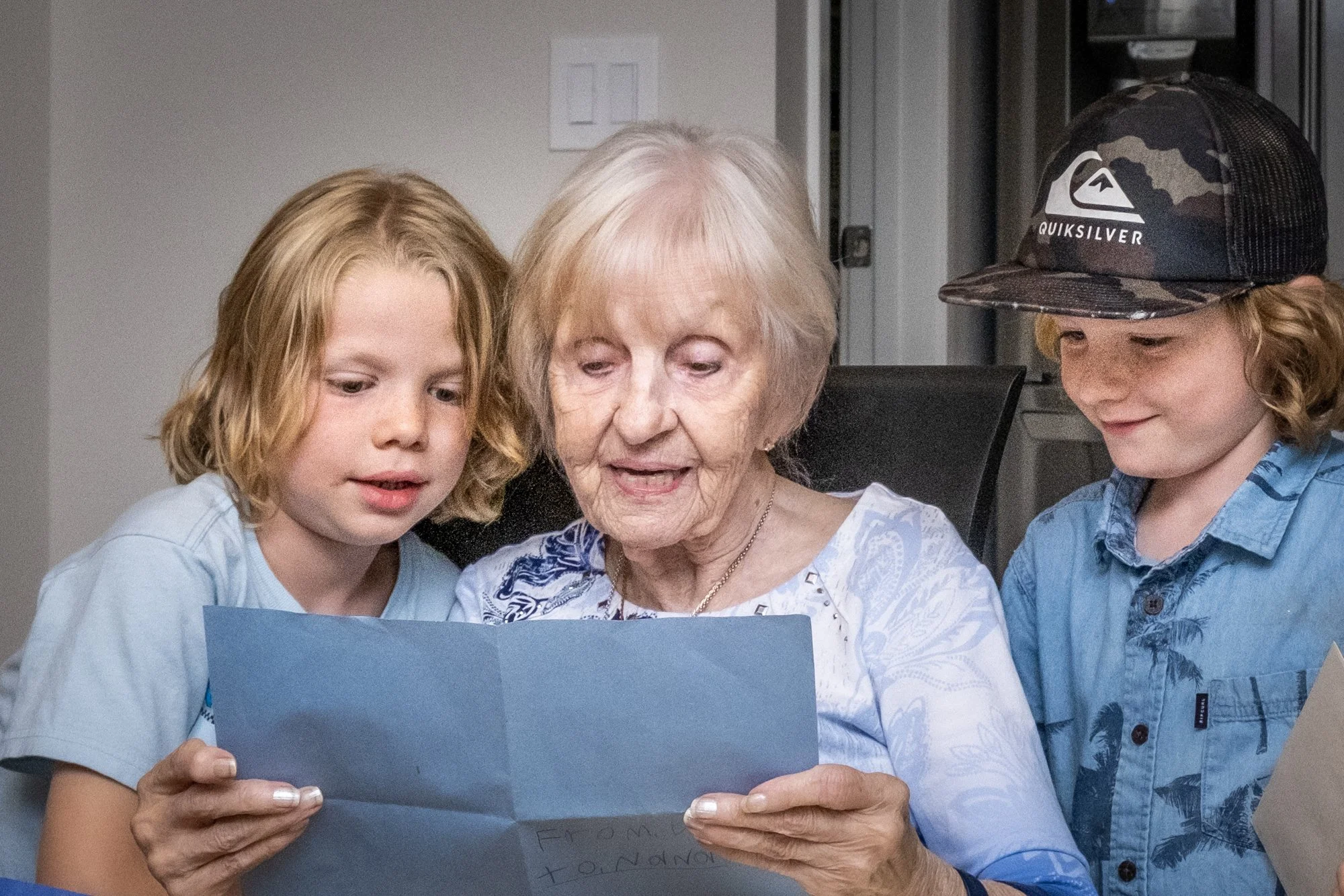 Nana reading a card from the boys. 