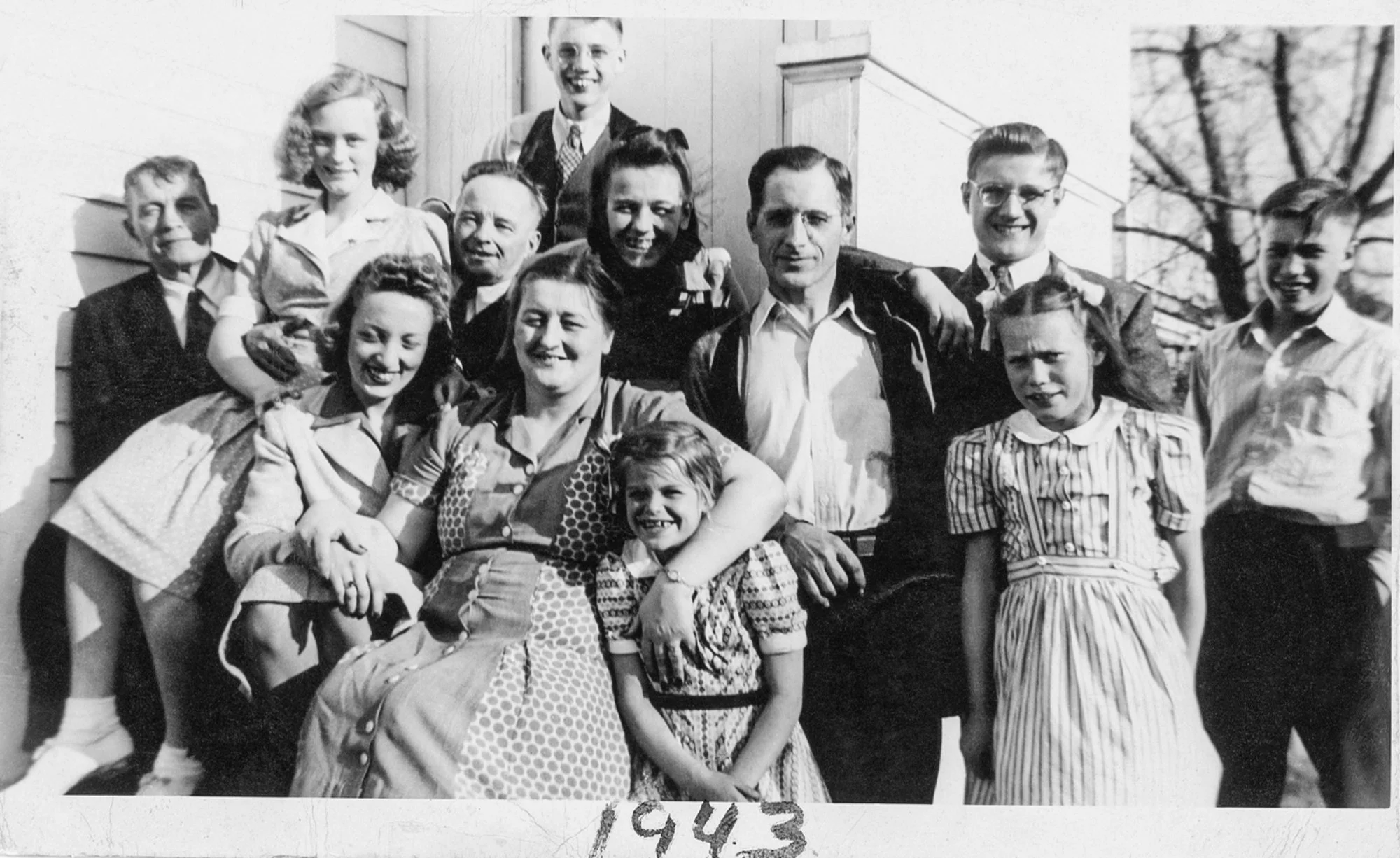 In the photograph, taken in 1943, we find Jacob Jachwak, the great-grandfather, standing in the far left. In the center is Anna (Jackwak) Kosila, accompanied by Jack Kosila. Third from right, we see Frank Cynowa, and in front of him is Julia Travis.