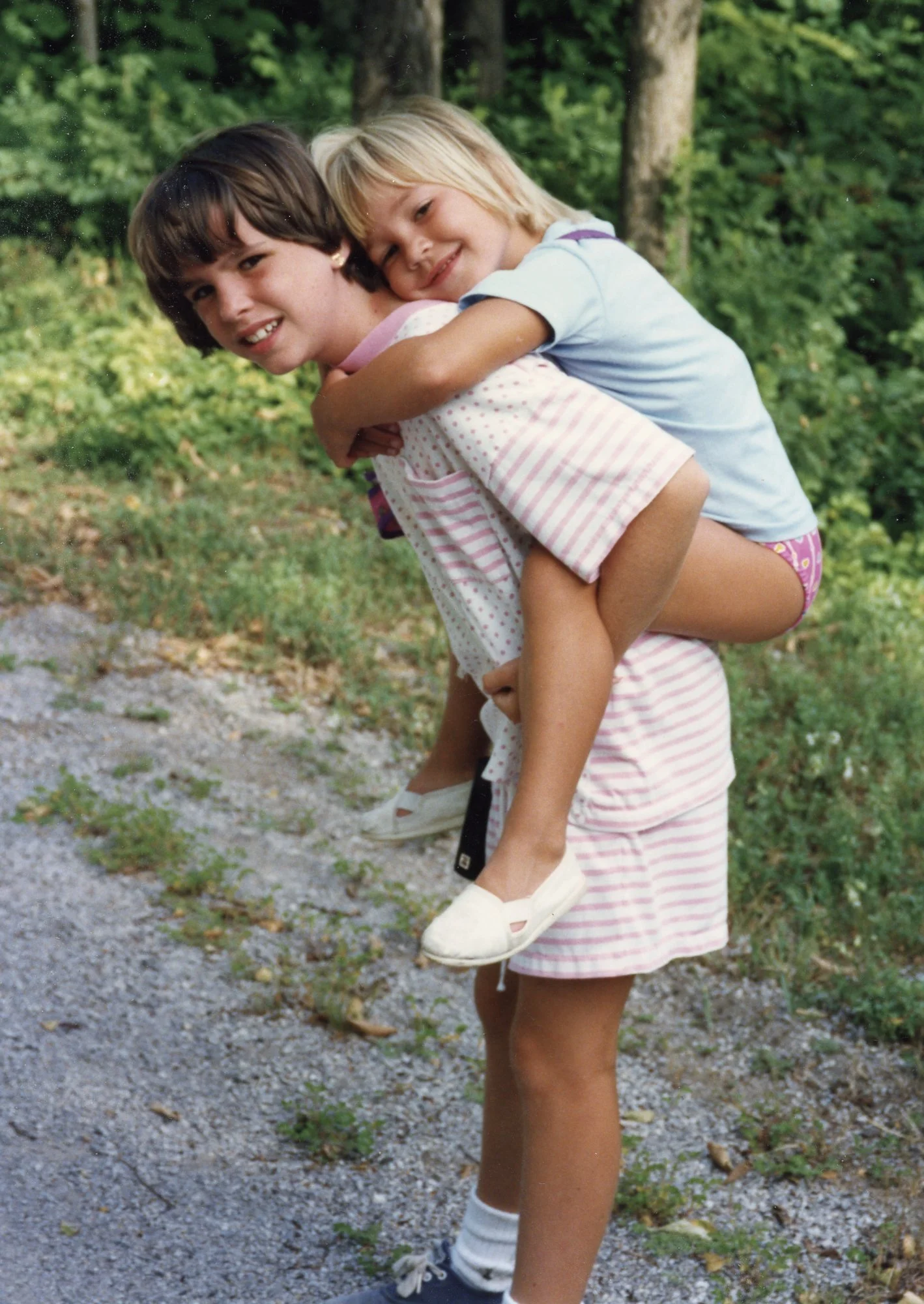 Kelly and Jenelle Miller taking a walk near the Miller compound on Long Lake, in Alpena Mi.