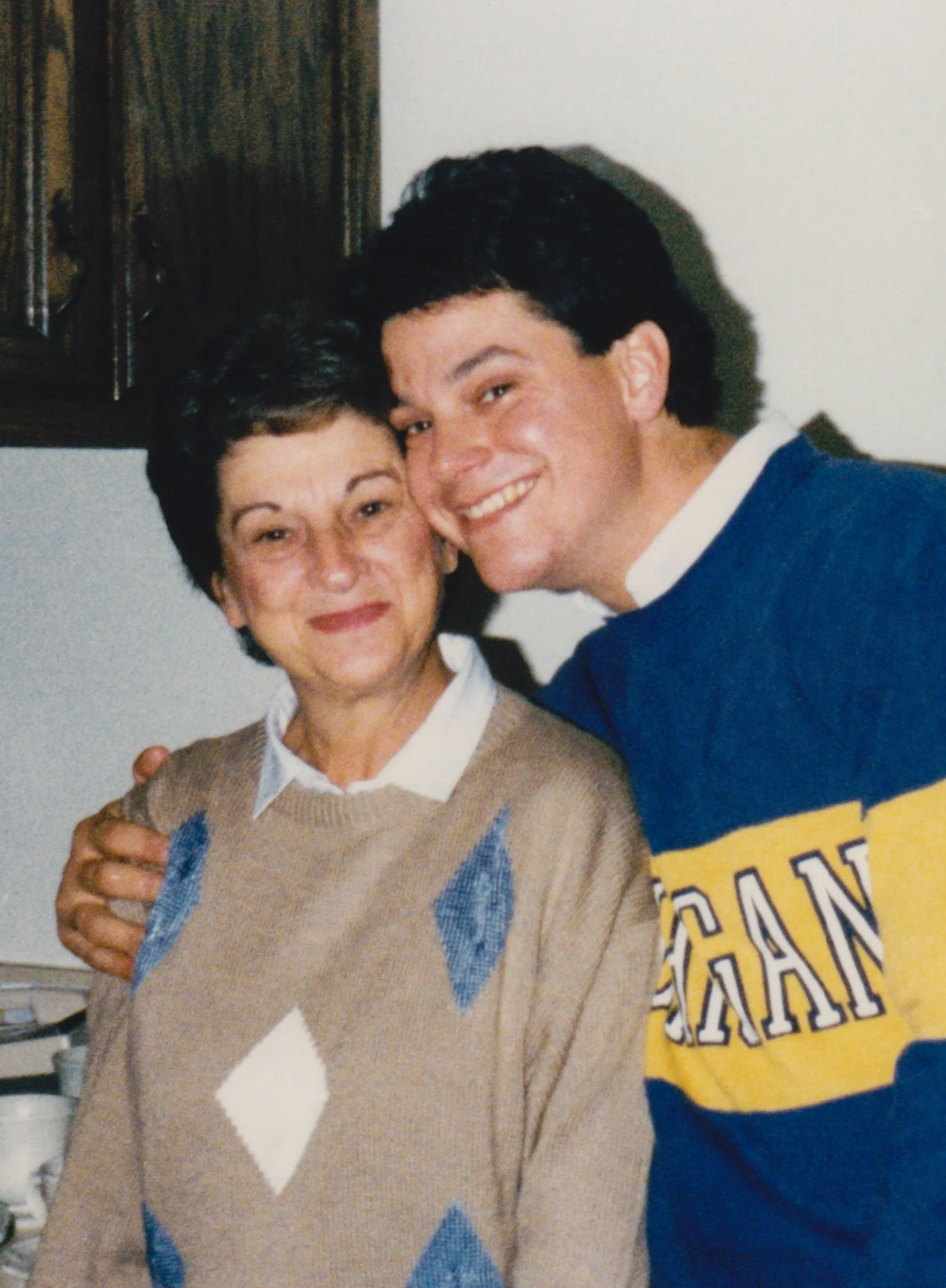 Rich giving Mom a hug on her 60th birthday at Rob and Roni's house. 