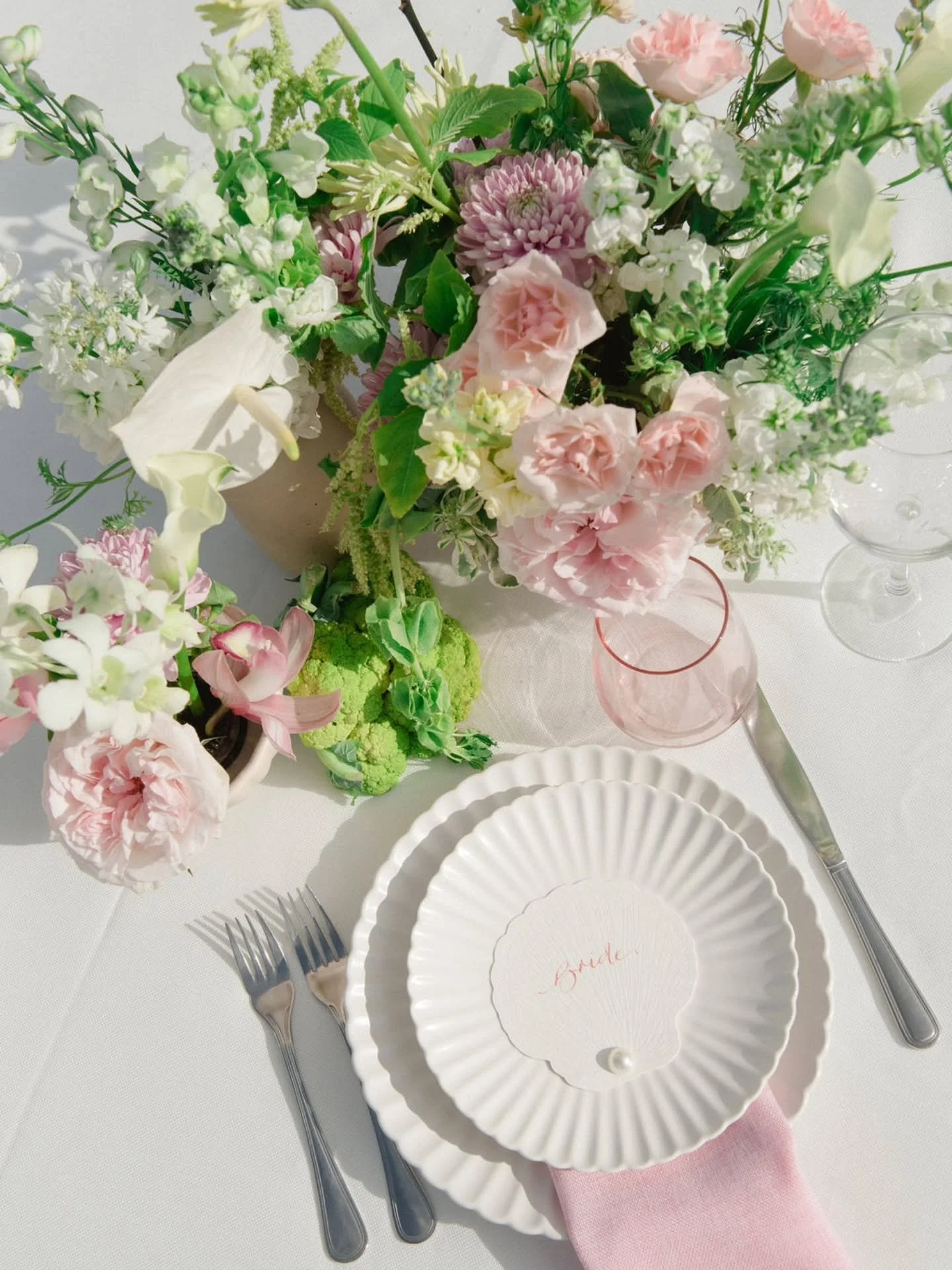 Loved designing this one! Soft and tropical. 
.
My favorites...the shell place cards, the soft pink palette, and the lime green cauliflower!! Can you spot it??!?! And last but not least, the groom who let his bride run with this pink!!! That's true l