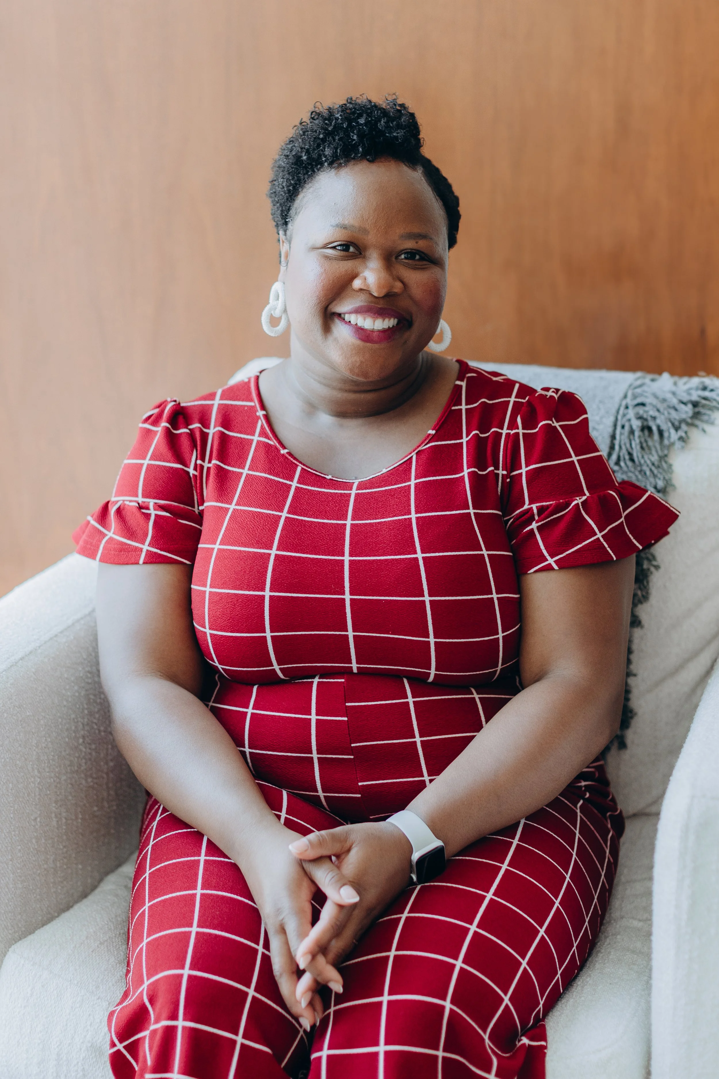 Candace Love, LCSW, Black therapist and founder of Clove Counseling in Lisle, IL, smiling while meeting with a client and providing trauma-informed individual and couples therapy for anxiety, depression, and relationship concerns.