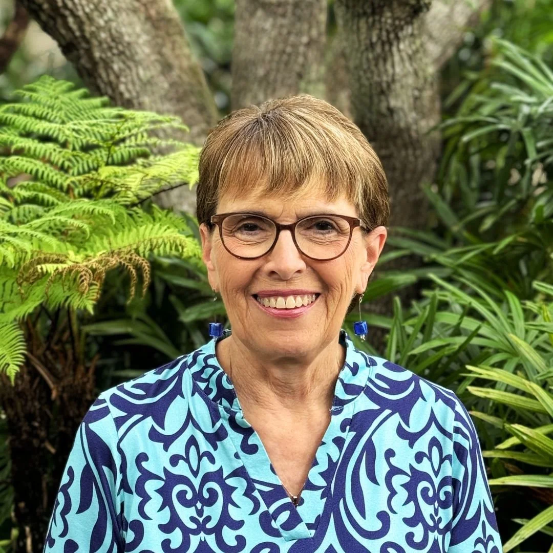 Woman with blue shirt, short hair and glasses who is the JupiterFIRST Church Preschool Co-Director Judy Harris