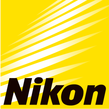 Close-up of the Nikon logo with yellow background and white streaks.