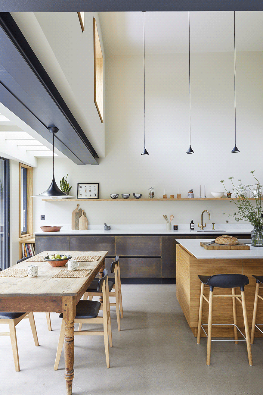 Open-plan kitchen interior with natural light and mezzanine above