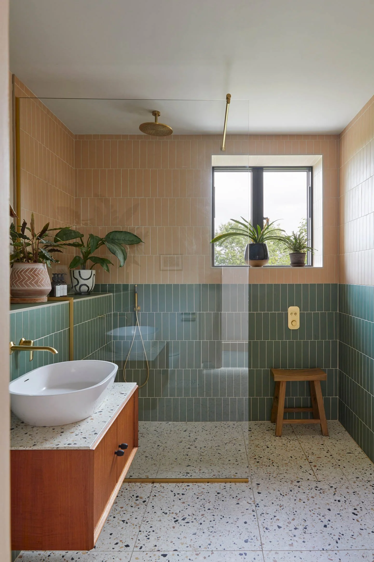 Interior Design of a calm contemporary bathroom with natural materials, soft daylight, and woodland-inspired design.