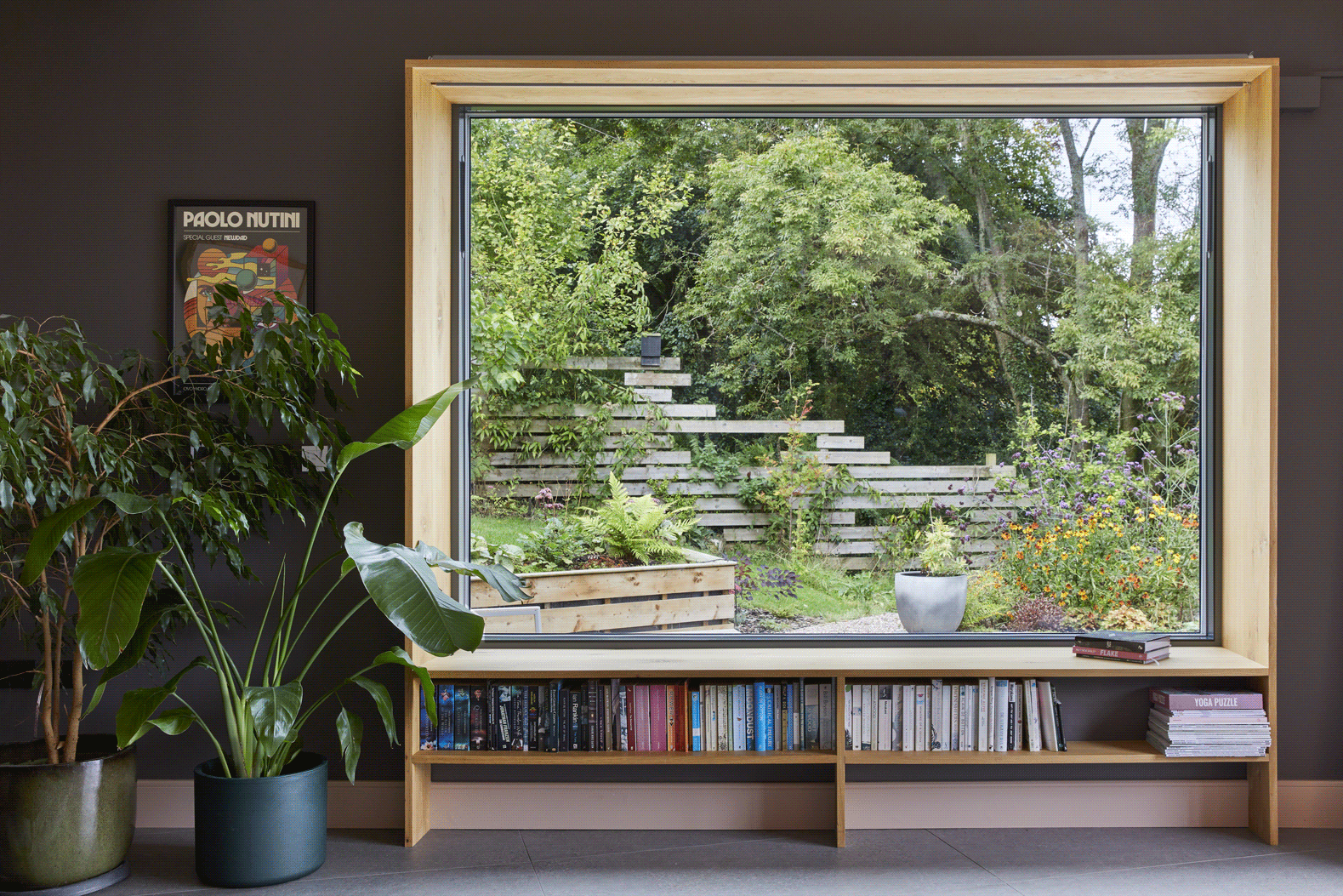 Floor-to-ceiling windows connecting the interior spaces to the Severn Valley beyond.