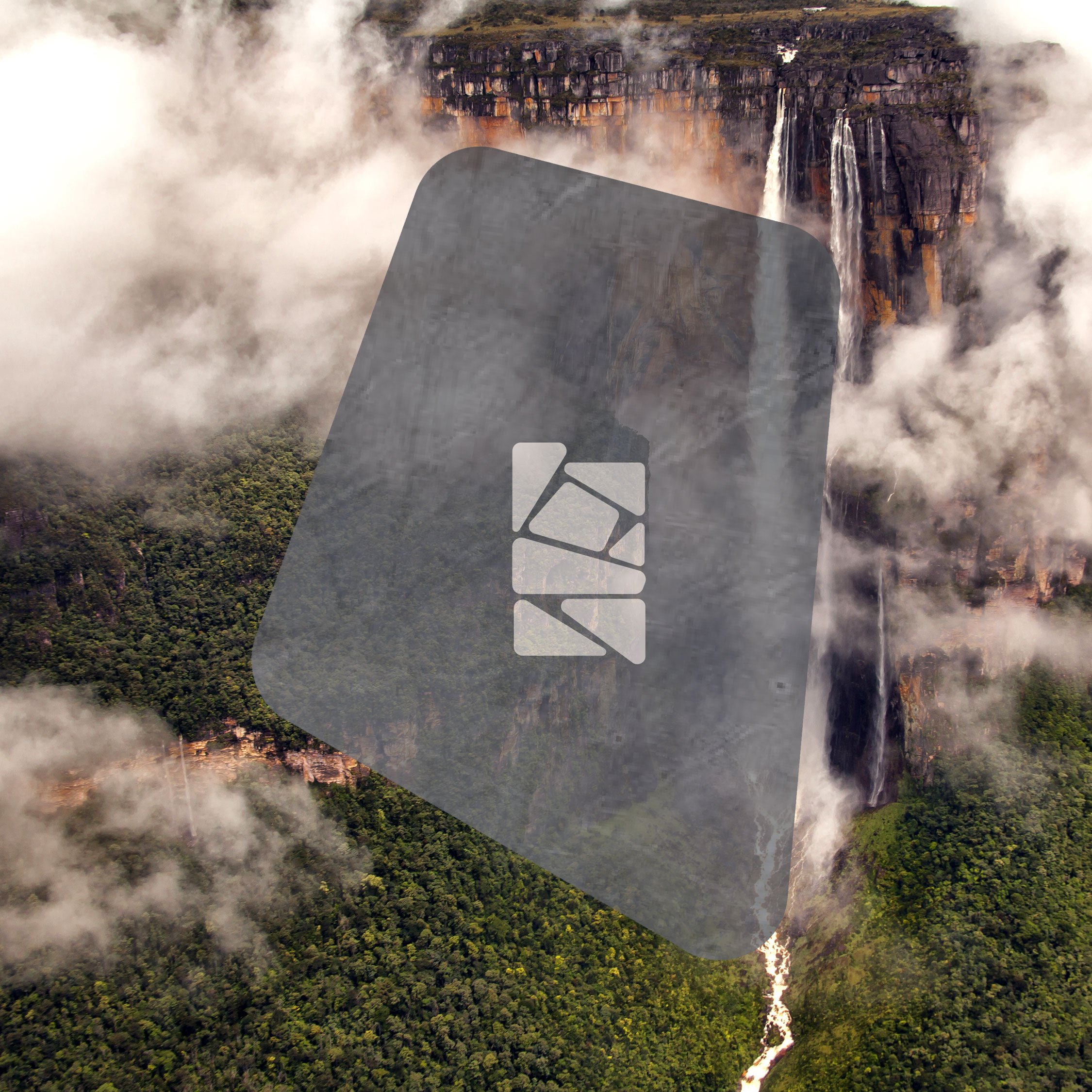Aerial view of a lush green forest with waterfalls and clouds, with a large gray and white logo overlay in the center, Angel Falls, Venezuela.