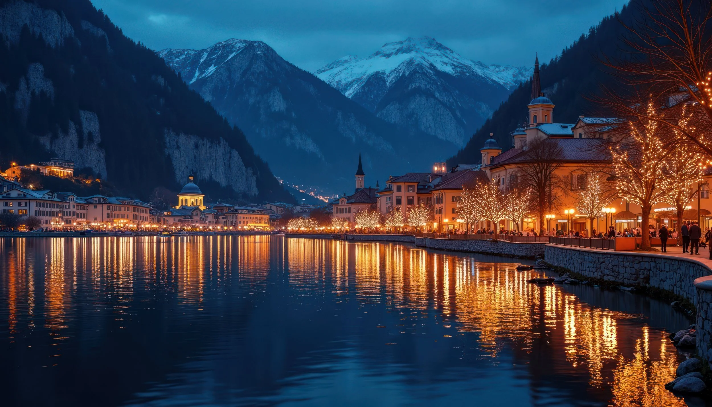 Nighttime view of Riva del Garda town center. Sparkling Christmas lights illuminate buildings, trees reflecting on lake.